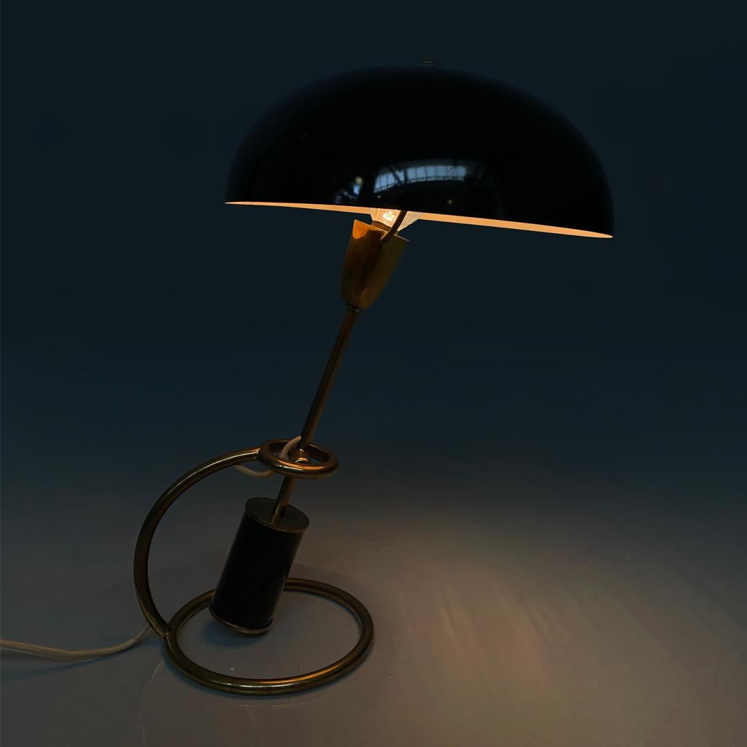 Italian mid-century modern lamp 12297 Scrittoio Angelo Lelii Arredoluce, 1950s
Table lamp model 12297 Scrittoio with round base. The structure is in brass rod, while the lampshade is in black painted metal with a matt finish, as is the cylinder at
