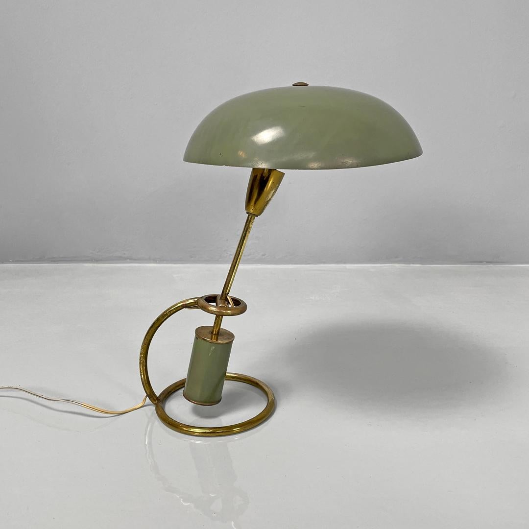 Italian mid-century modern table lamp 12297 Scrittoio di Angelo Lelii per Arredoluce, 1950s
Table lamp mod. 12297 Scrittoio with a round base. The structure is in brass rod, while the lampshade is in green painted metal with a matt finish, as is the
