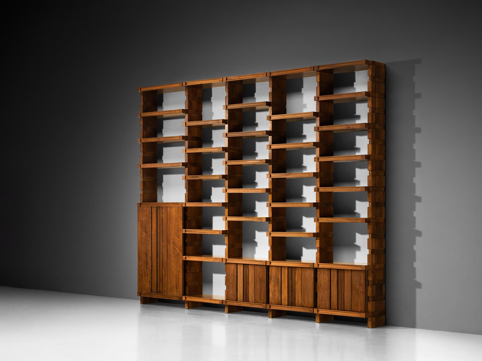 Library wall-unit, walnut, Italy, 1960s

Rooted in Italy’s mid-century design tradition, this substantial bookcase highlights the makers architectural sensibility and refined taste for elegant proportions. The composition is based on five columns,