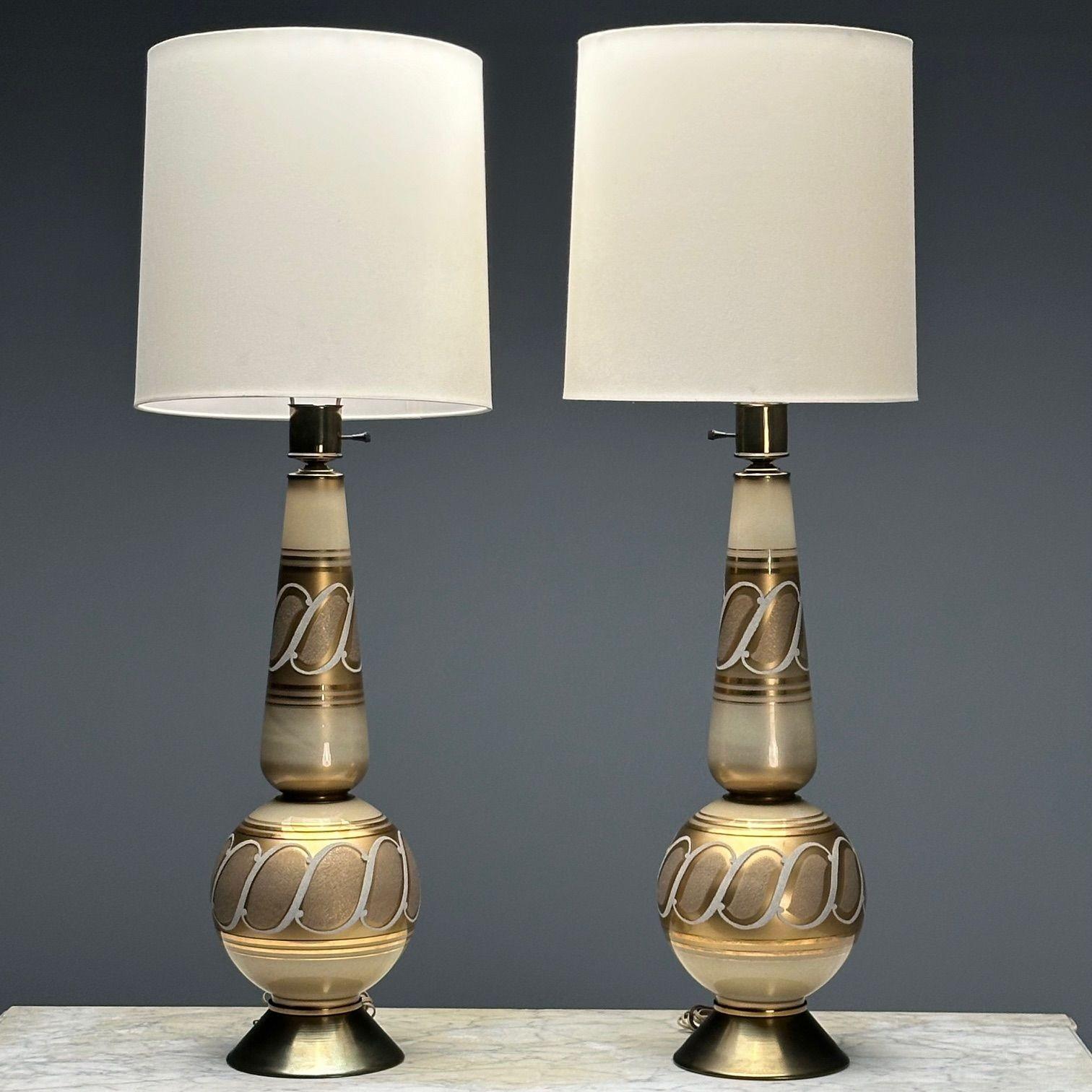 Italian Mid-Century Modern, Large Table Lamps, Gold Glass, Brass, Italy, 1960s

A pair of large glass table lamps designed and produced in Italy during the mid-century period. Having intricately decorated gilt glass and brass detailing. Shades