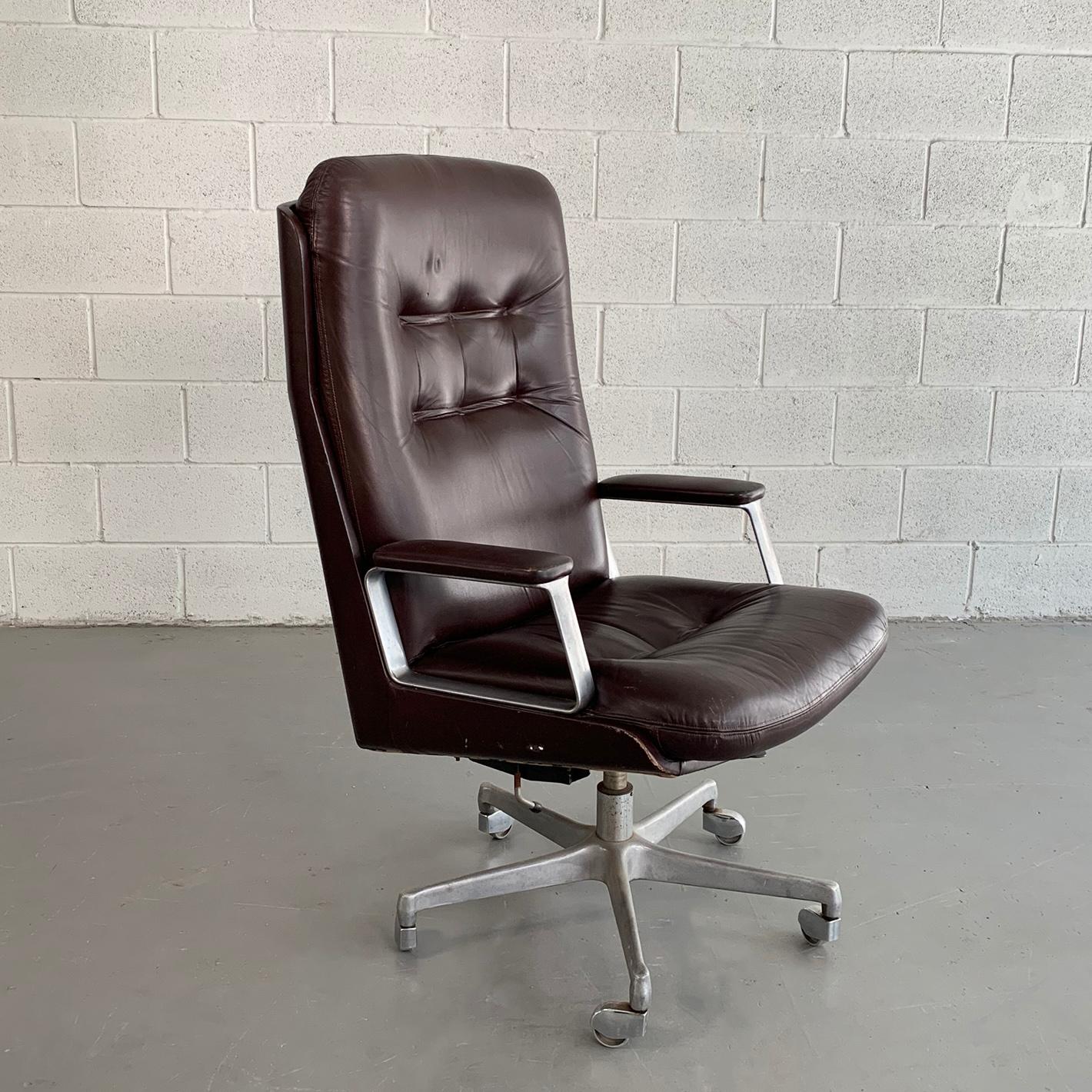 Mid-Century Modern, executive, office armchair by Italian manufacturer Vaghi features a maroon leather body with high back on a rolling, adjustable aluminum frame.