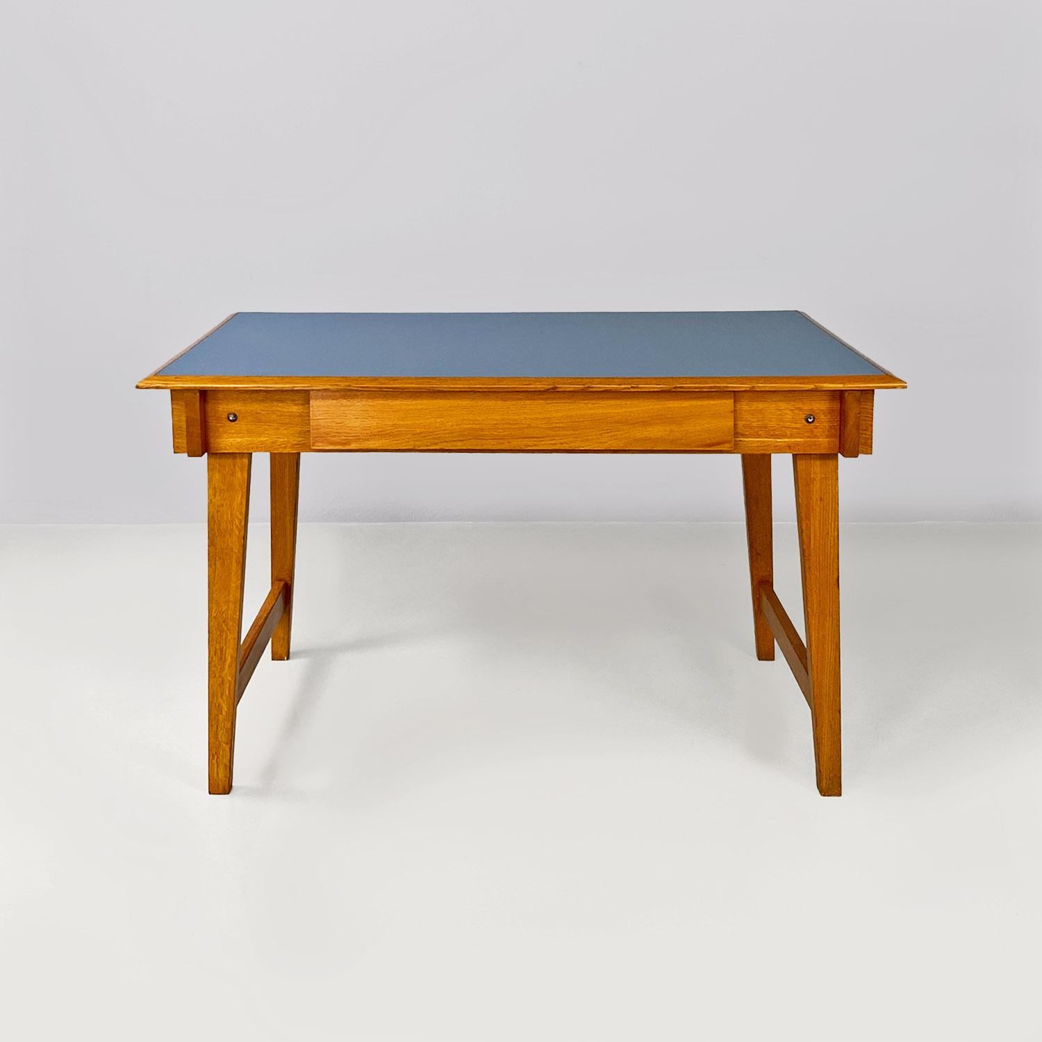 Italian mid-century modern, light blue laminate and solid wood desk, with drawer, 1960s.
Desk with rectangular top in light blue Formica, with light solid wood structure, composed of four legs and a central drawer. Coming from the R. Enaudi