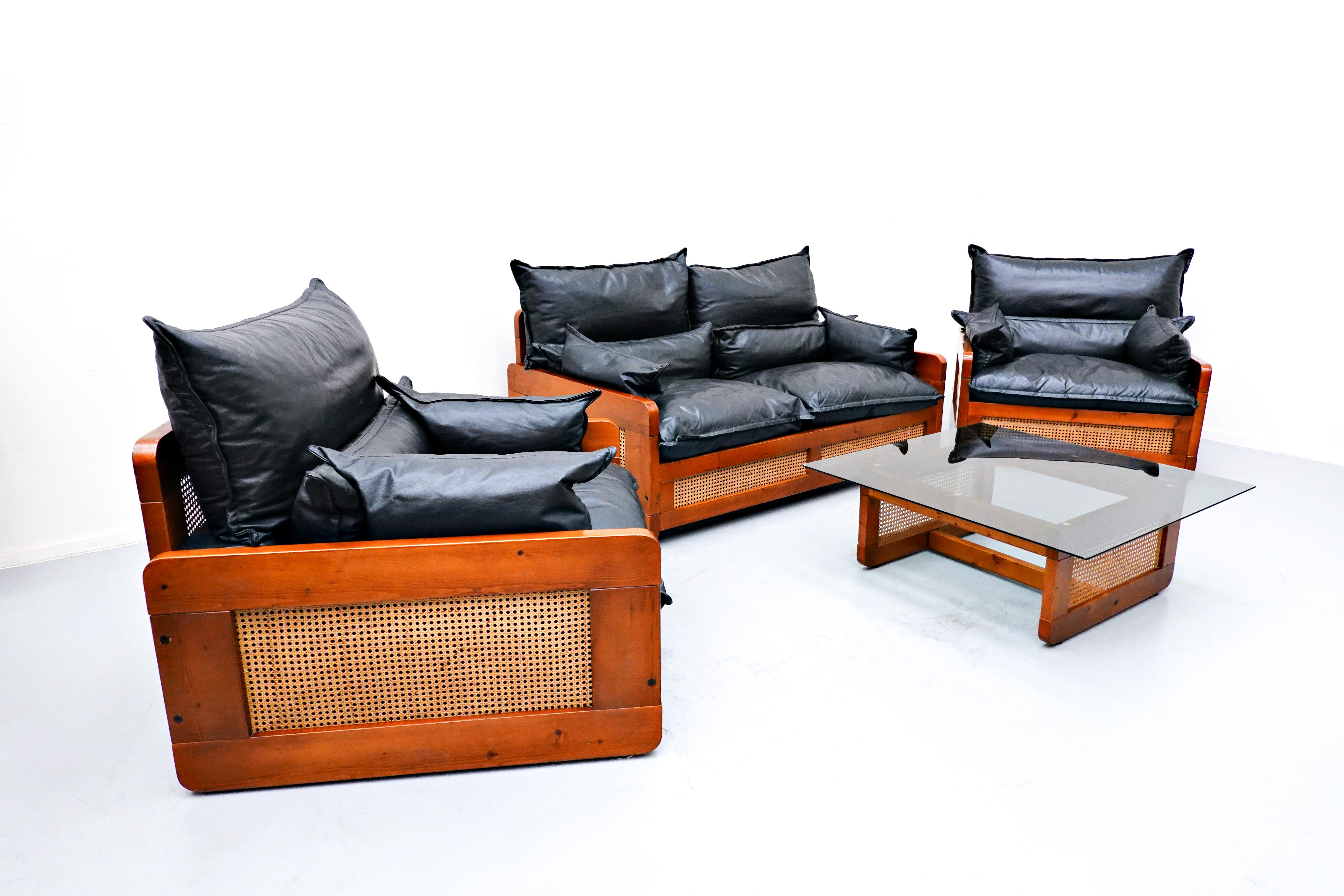 Italian Mid-Century Modern Black Leather Living Room Set, 1970s
European 
One sofa 
Two armchairs 
One table 
Dimensions: 1 place W 92.8cm, D 92cm, H 80, SH 40
2 place W 153, D92, H80, SH 40
Coffee table W 89.5, H 33.8.