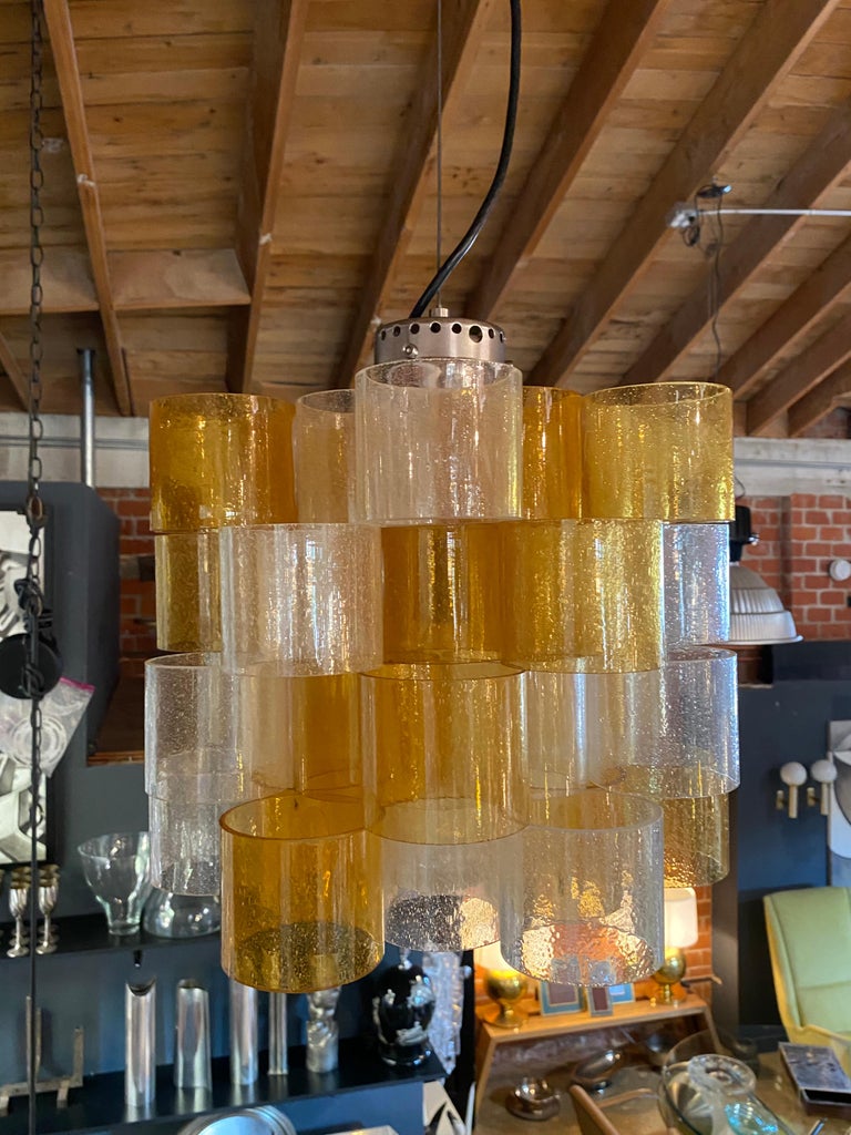 Italian Mid-Century Modern pendant / fixture composed of bicolor cylindrical rings of Lucite (plexiglass / Perspex) cantilevered in an architectural manner.
Height of fixture alone is 12