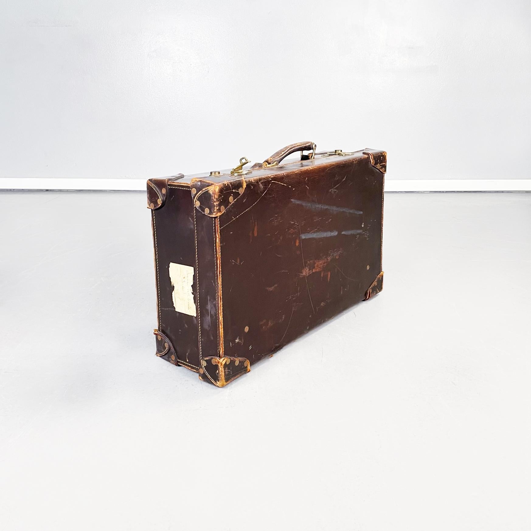 Italian Mid-Century Modern Luggage in brown and green leather, 1970s
Rectangular suitcase in brown leather. Brass closure, handle present. Forest green leather interior with a pocket and thin brown leather straps. Can be used as a container at