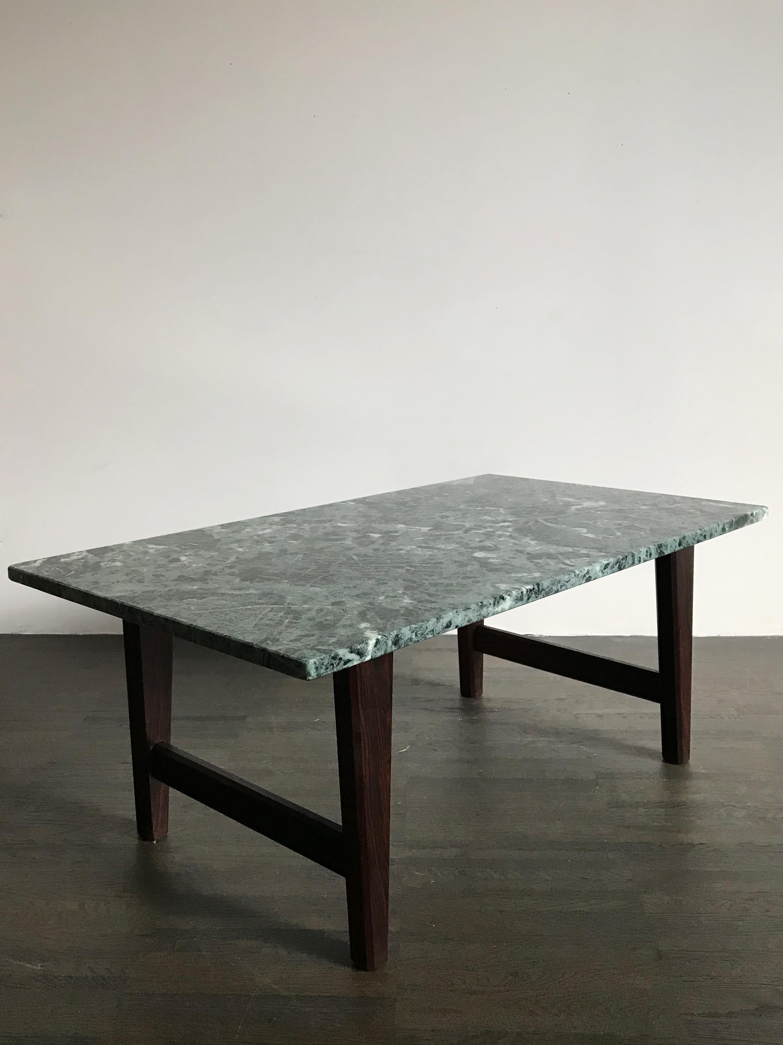 Italian coffee table with dark wooden legs and amazing green Alpi marble top, 1960s.
The top is in very excellent condition, no broken no scratch.
Please note that the coffee table is original of the period and thus shows normal signs of age and