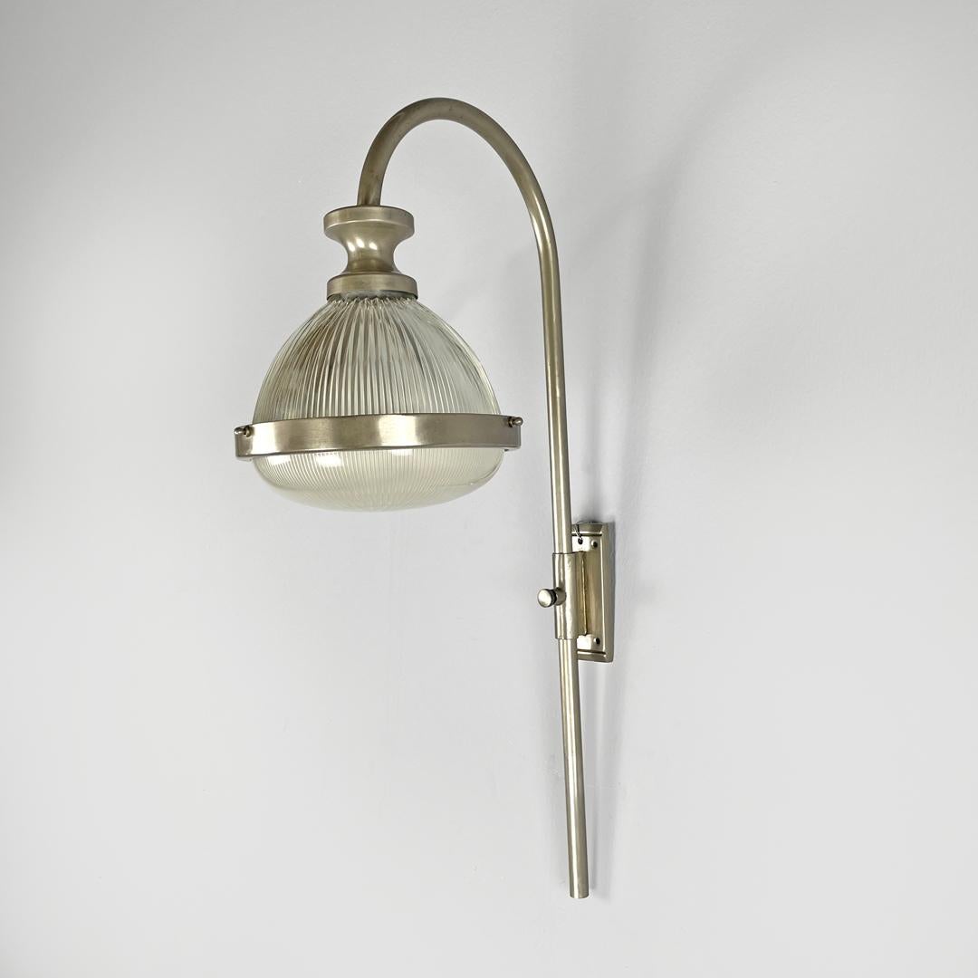 Italian mid-century modern metal wall lamp by Sergio Mazza for Artemide, 1960s
Wall lamp or applique in metal. The adjustable elongated stem is in metal tubing, in the upper part curved downwards where the light point is located, with a transparent