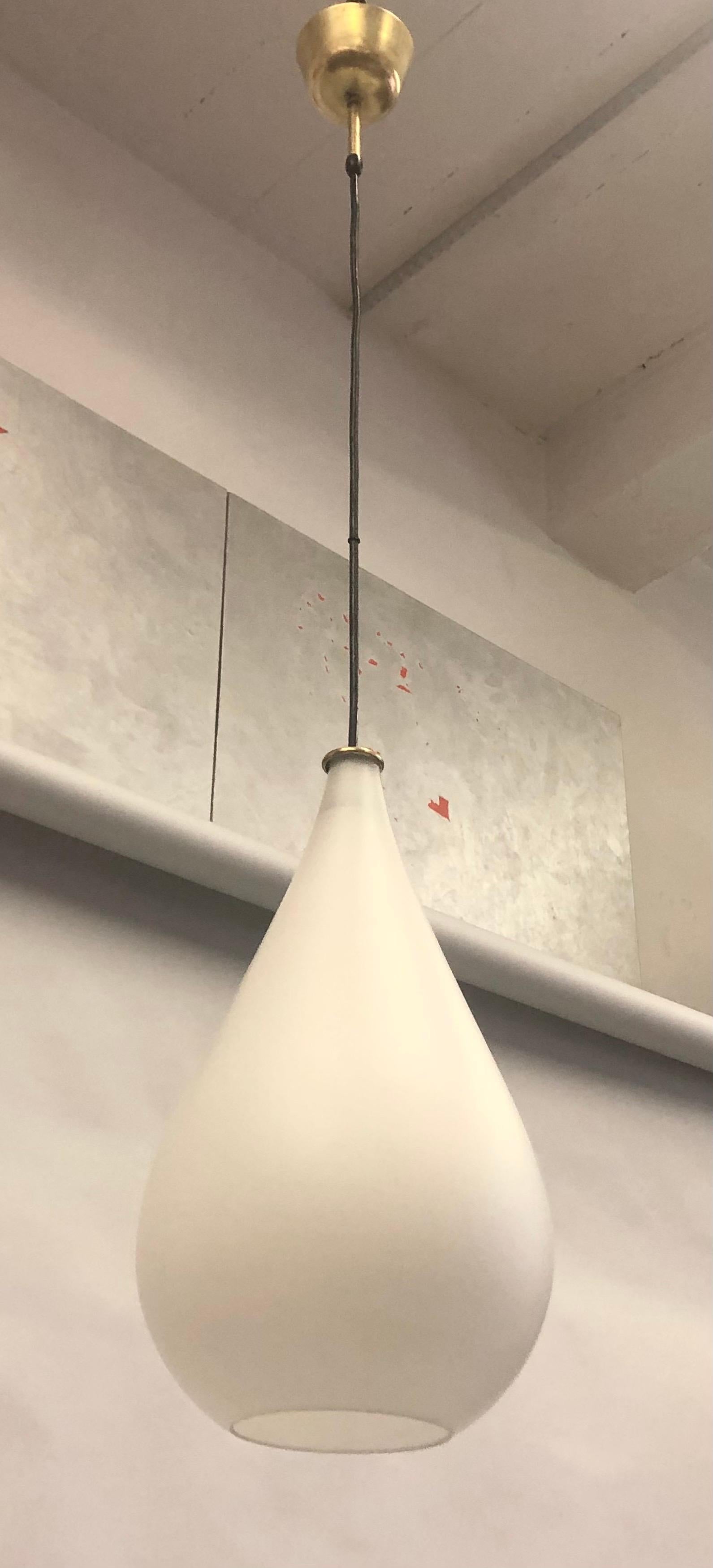 A Timeless Italian Mid-Century Modern mold blown glass pendant / chandelier or lantern in the form of a teardrop by Max Ingrand for Fontana Arte. The piece is elegantly blown into sensuous tear drop form in satin frosted glass. It is finished with
