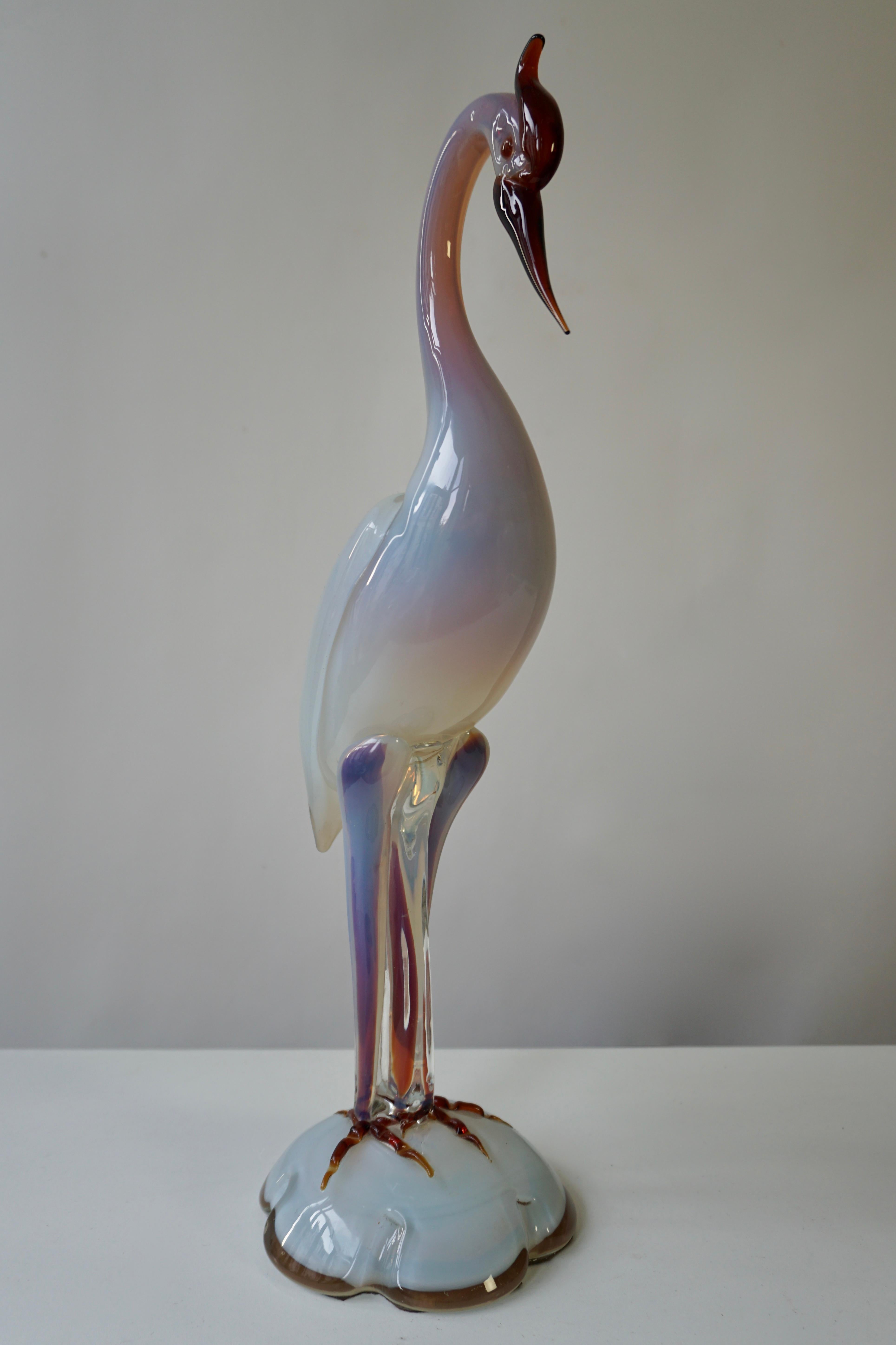 Elegant Italian Mid-Century Modern hand blown Murano glass bird sculpture. 
The piece was likely made during the 1960s in Italy and is in great vintage condition.

Measure: Height 47 cm.
Weight 4 kg.