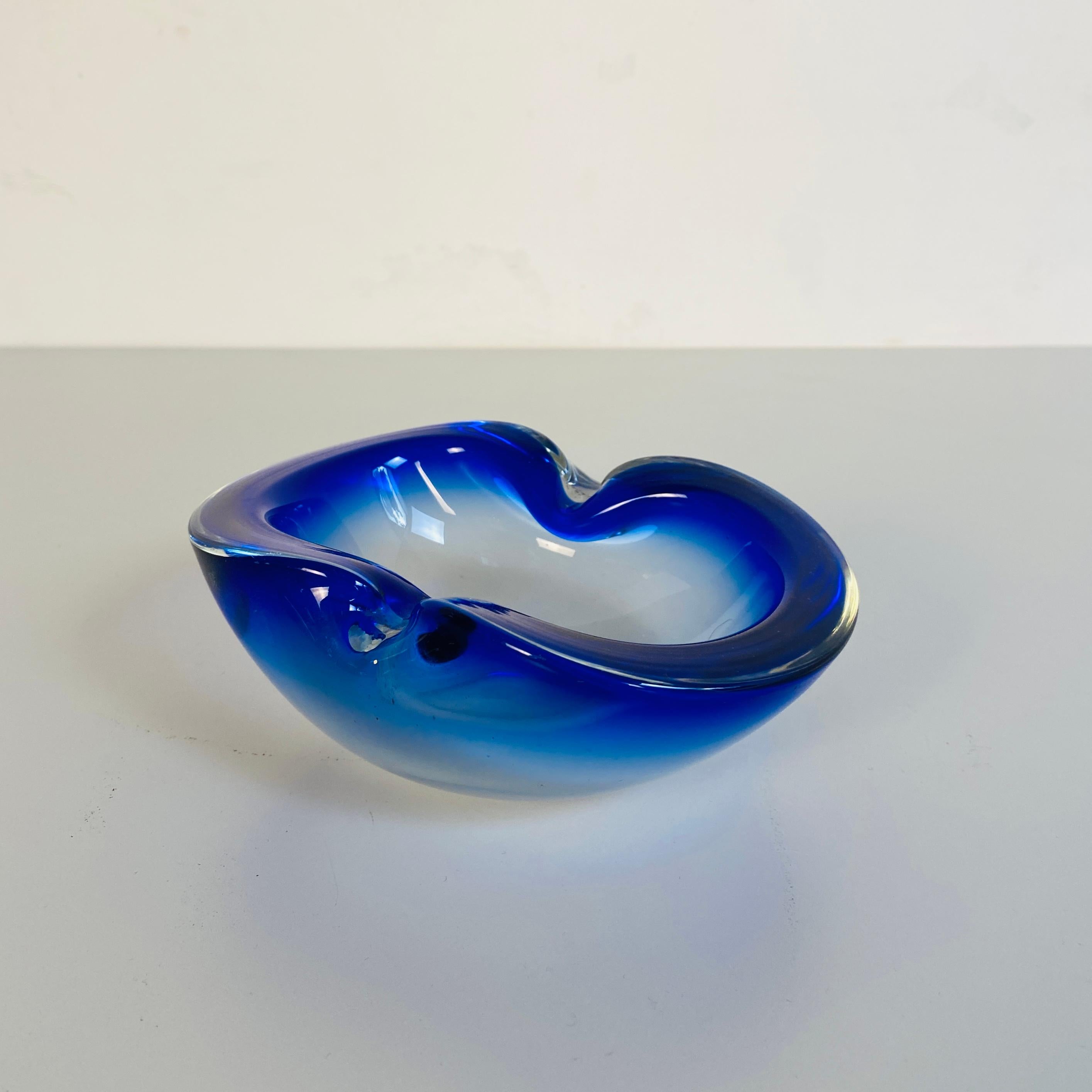 Italian Mid-Century Modern Murano glass oval object holder in blue, 1970s
Oval object holder in Murano glass, polychrome, transparent at the base and blue on the edges.

It is in very good condition.

This Fantastic series of Murano glass vase and