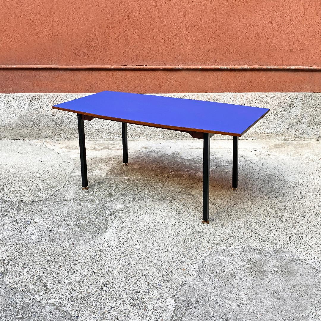 Italian Mid-Century Modern octagonal blue formica dining table, 1960s. 
Slightly octagonal shaped dining table with wooden structure, matt black metal leg with adjustable brass tips and top covered with a new matt blue laminate.

Perfect
