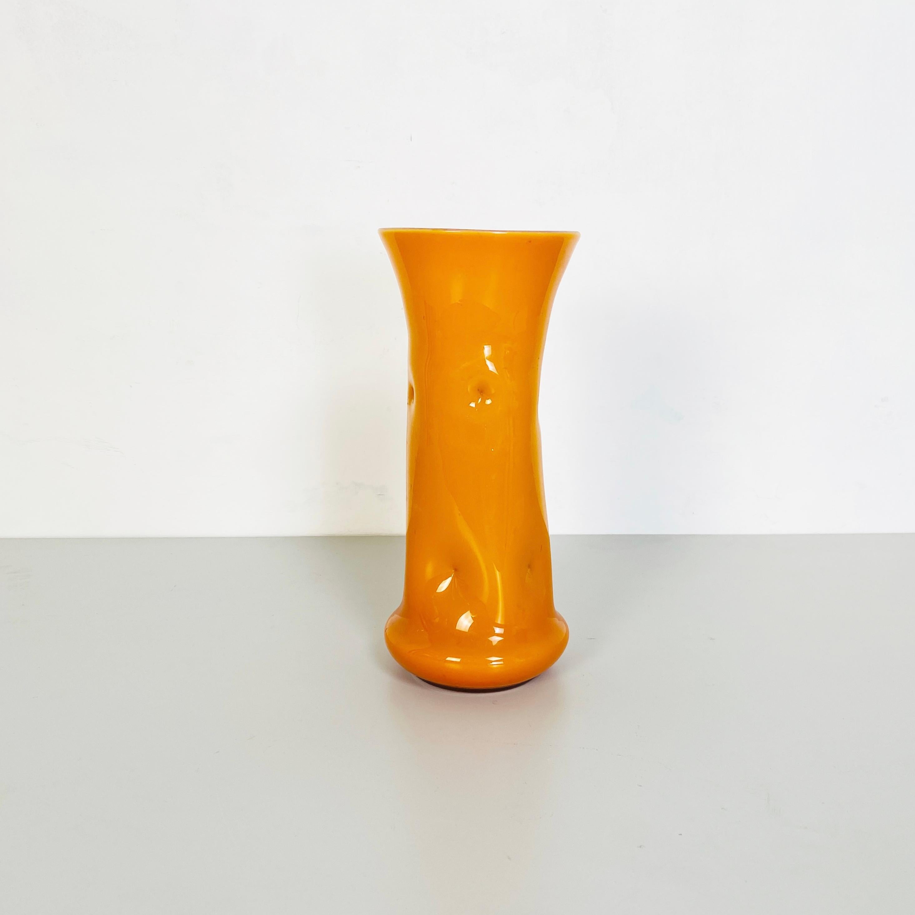 Italian Mid-Century Modern Orange glass vase, 1970s
Beautiful and decorative orange irregular shape glass vase in 1970 periods glass of  Murano Italy.

This vase remember the work of the famous glass designer Tony Zuccheri who work in Murano in this