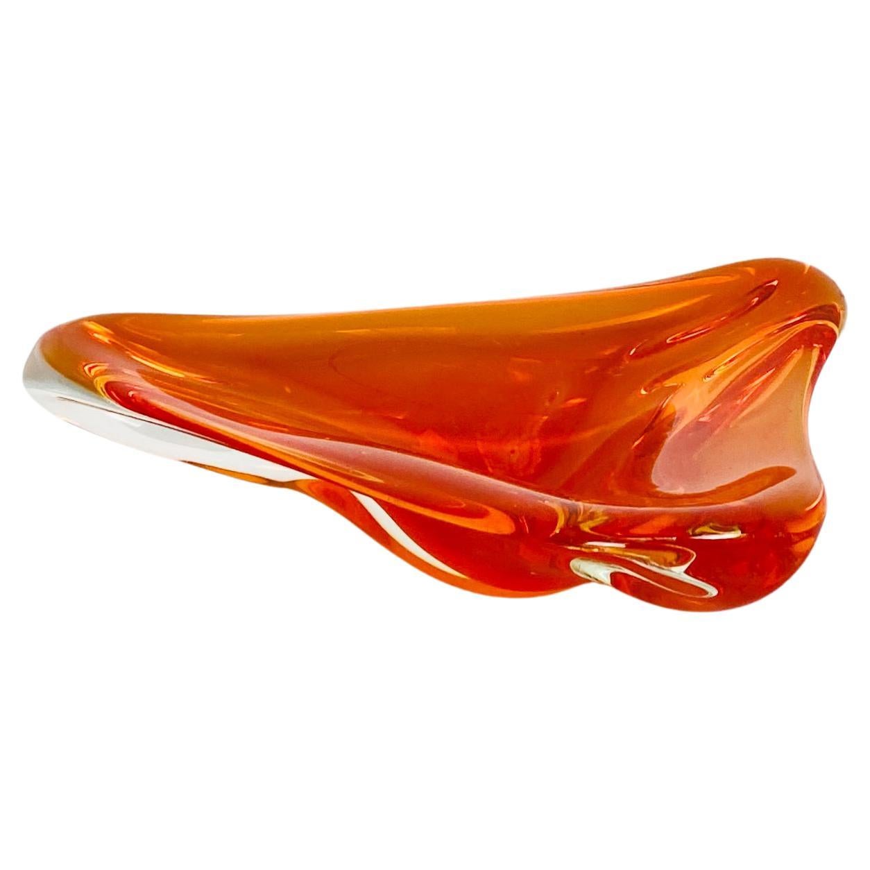 Space age Orange and trasparent Murano glass ashtray, form 1970 period. 
This ashtray have an irregular shaped and the orange color is obtained with the same technique of the 