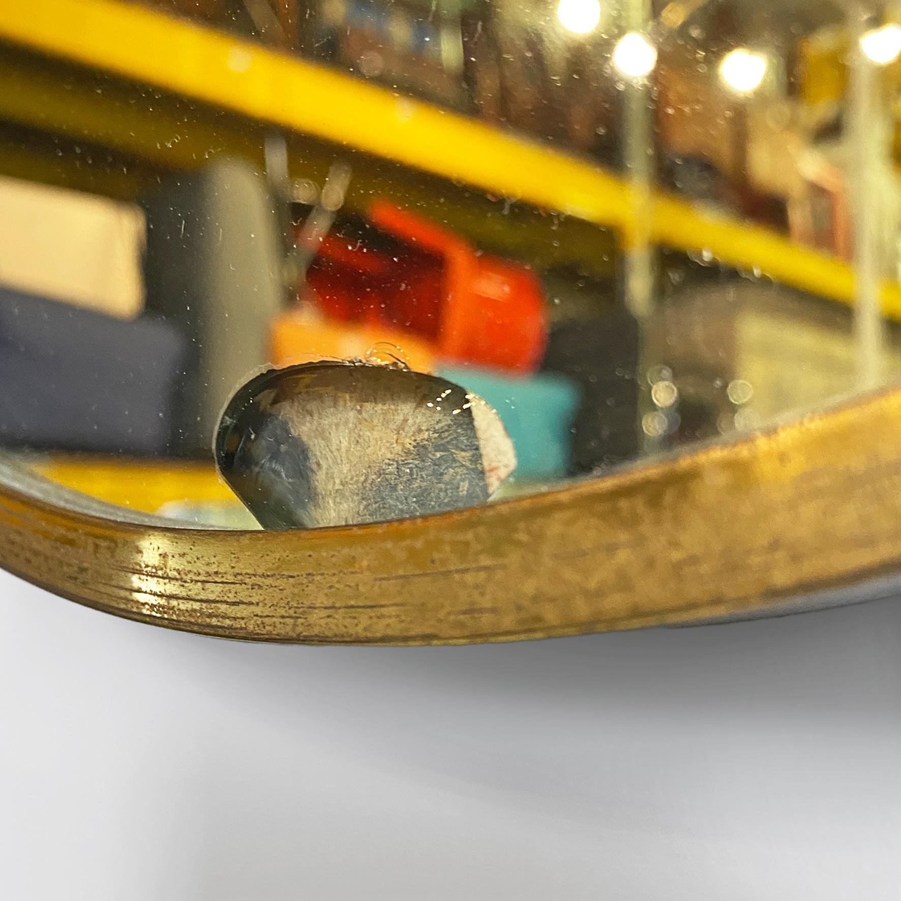 Brass Italian mid-century modern oval brass wall mirror with classic friezes, 1950s For Sale
