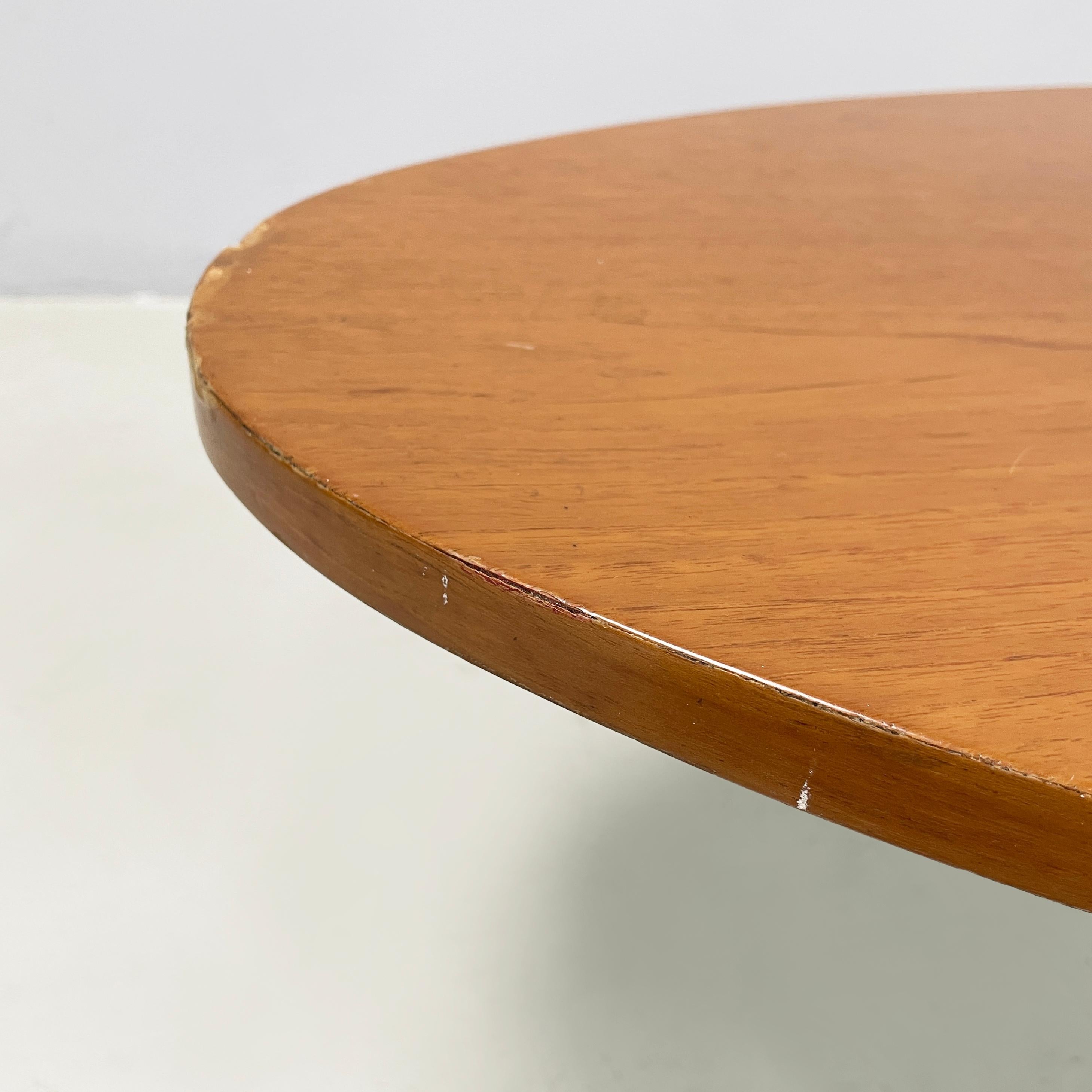 Mid-20th Century Italian mid-century modern Oval coffee table in wood and black metal, 1960s For Sale