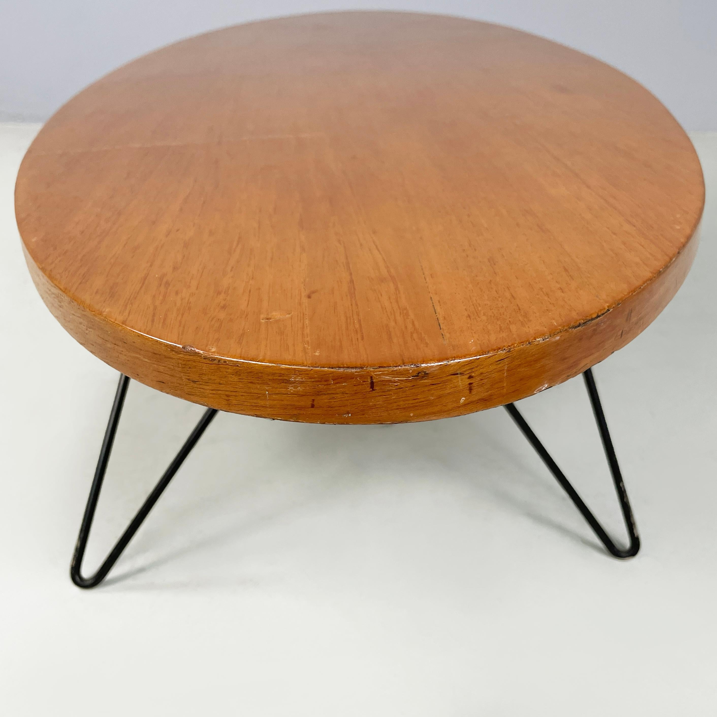 Metal Italian mid-century modern Oval coffee table in wood and black metal, 1960s For Sale