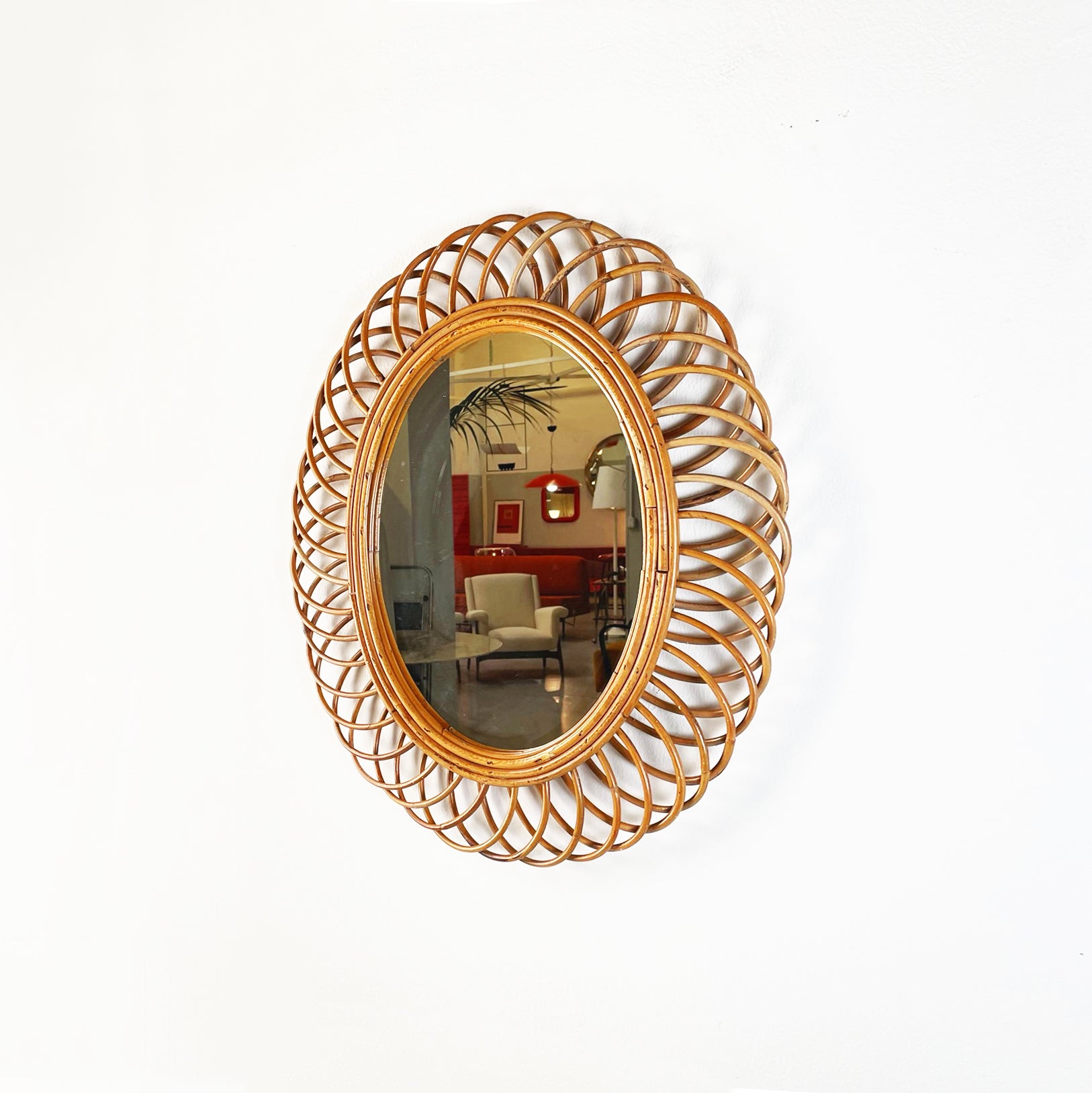 Italian mid-century modern Oval-shaped wall mirror in curved rattan, 1950s
Oval-shaped wall mirror with finely worked curved rattan frame.
1950s.
Very good conditions, shows small signs of ageing.
Measurements in cm 56 x 3 x 70 H
This wall