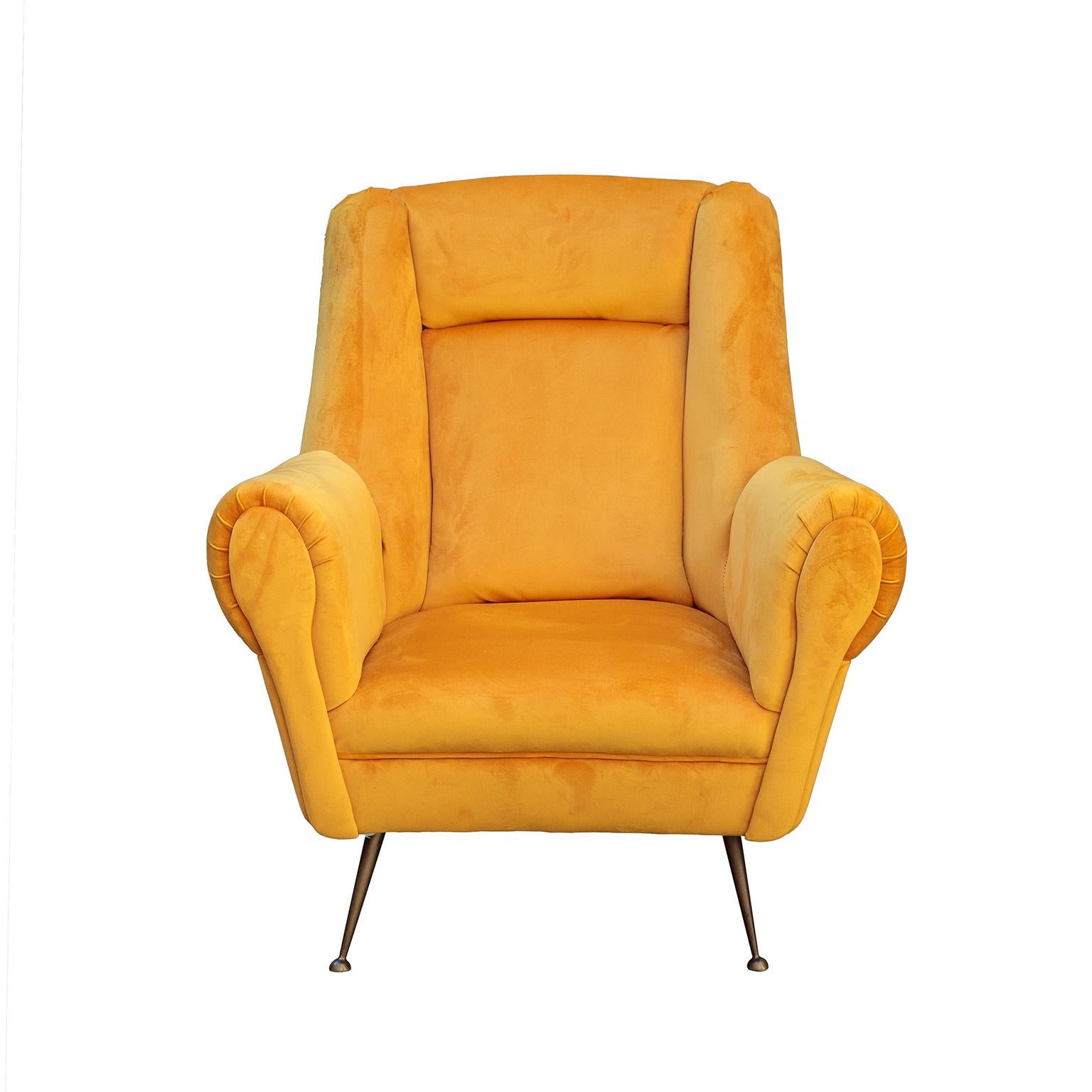 Pair of Italian Mid-Century Modern yellow velvet armchairs designed a high comfortable backrest and buttons manufactured by ISA Bergamo.
In fully restored condition with new foam padding, yellow velvet up and iconic polished brass legs.
Italy,