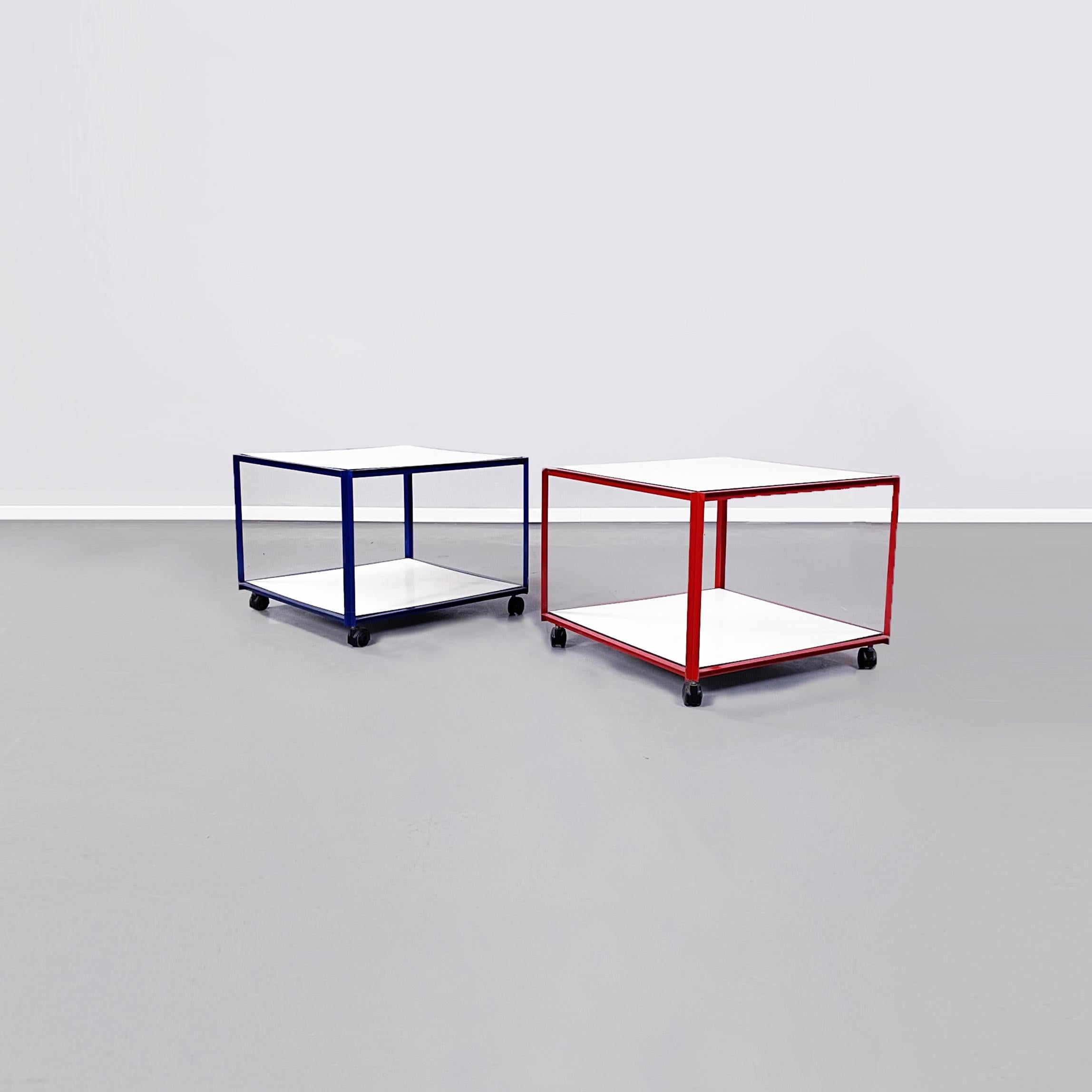 Italian Mid-Century Modern pair of ??coffee tables by Alias, 1980s.
Pair of coffee tables with two tops in white painted wood and metal structure painted in red and blue. Can be used as carts.

Produced by Alias ??Italia, with label present on