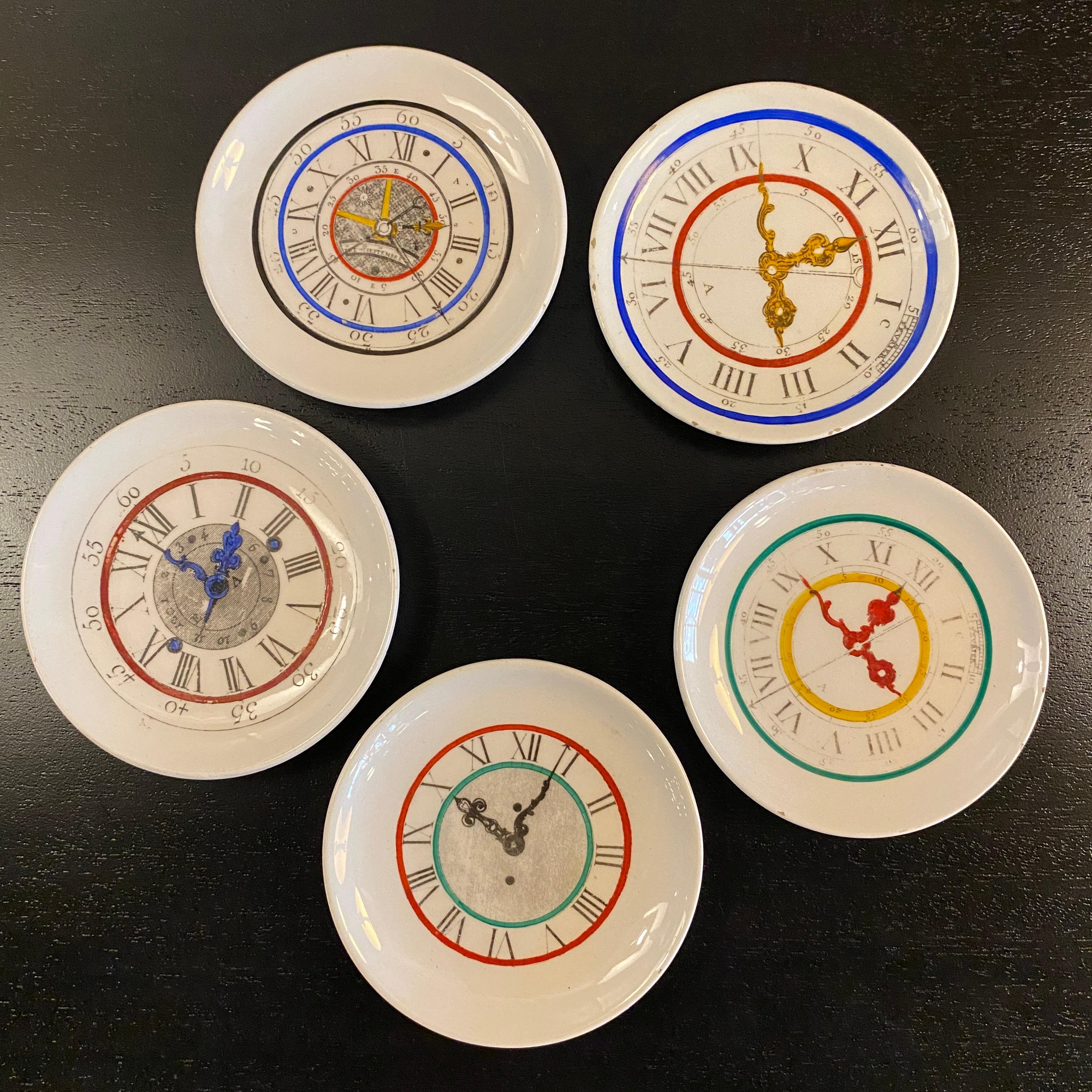 Set of five, Italian, mid-century modern, petite, decorative, porcelain plates with clock motif. This playful set can be used to serve small bites or for display. They are signed Myriam Fabbricatto in Italia. 