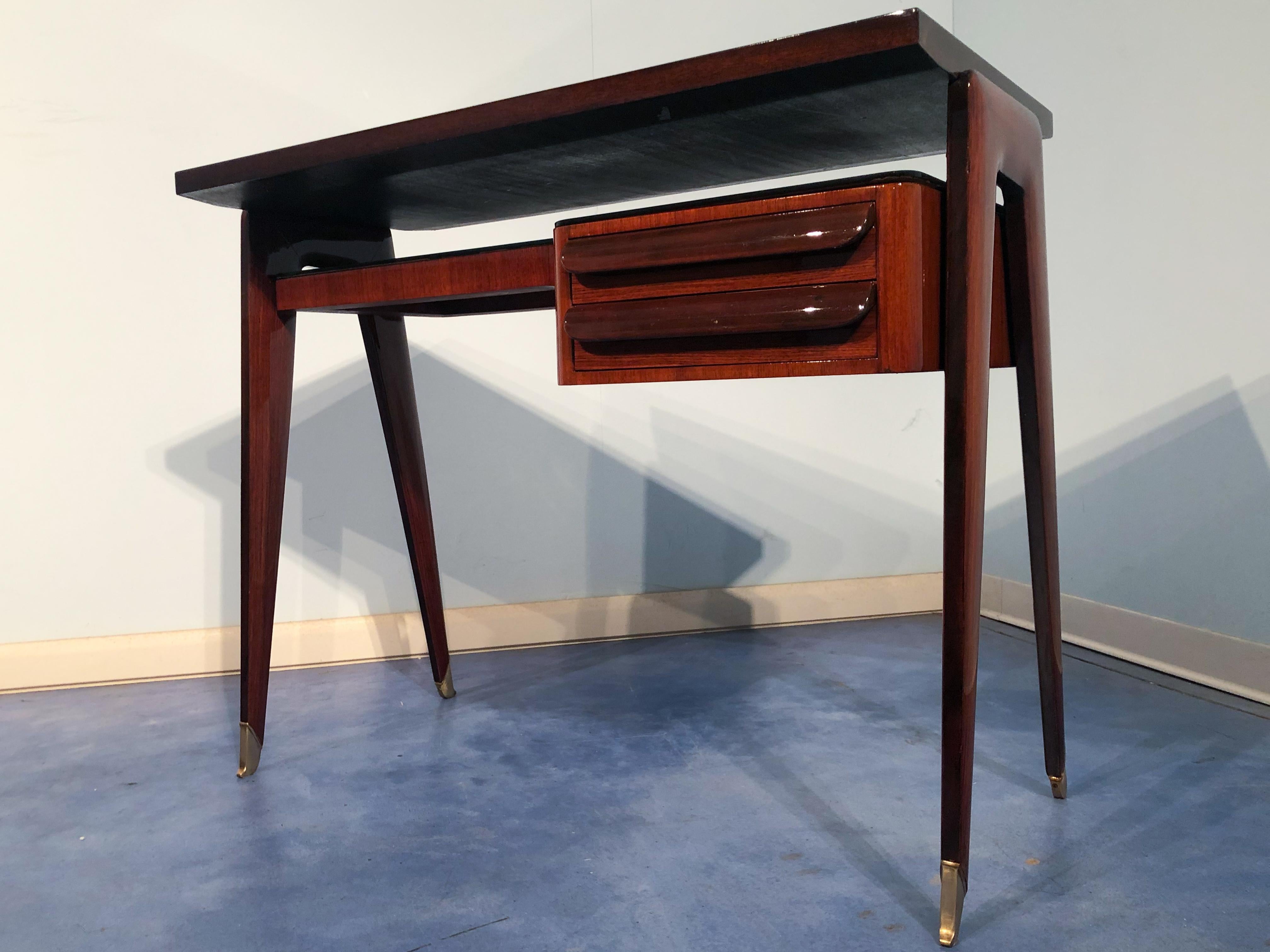 Stylish Italian Mid-Century Modern petite desk in teak from the 1950s elegantly named 
