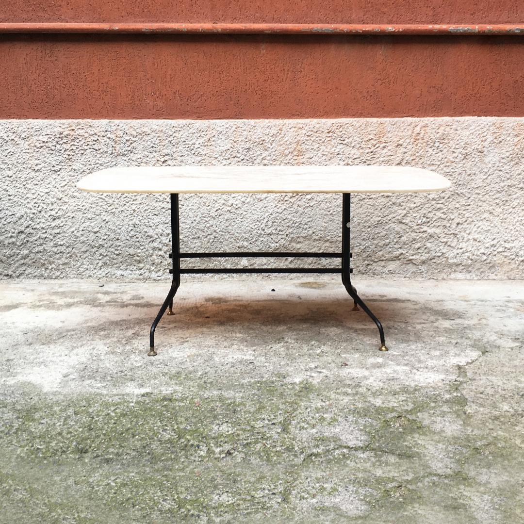 Italian Mid-Century Modern Portuguese marble and metal coffee table, 1960s
Marble coffee table with structure in curved black metal rod and brass tips, double central decorative and structural tie and top in pink Portuguese marble,
circa