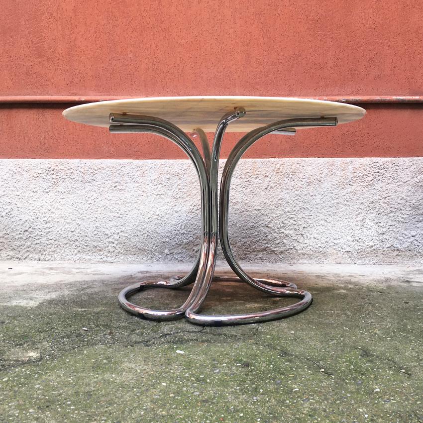 Italian Mid-Century Modern Portuguese marble table with chromed structure, 1970s
Dining table with Portuguese pink marble top with very particular veins and articulated structure in chromed steel.

Very good condition

Measures: 120 x 75 H cm.