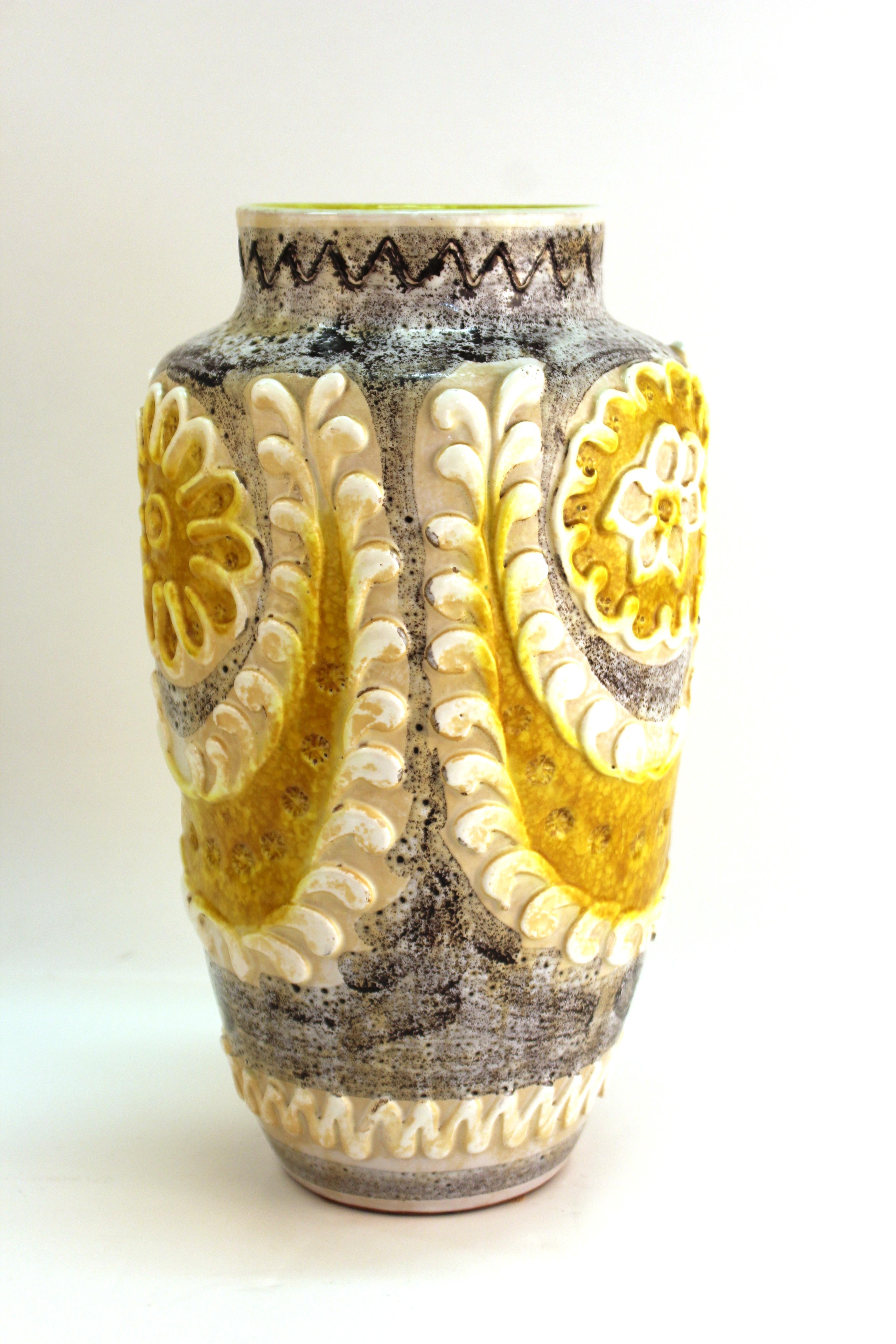 Mid-Century Modern pottery vase with floral decor and pastillage relief. The piece is marked 'Italy' on the bottom. In great vintage condition with age-appropriate wear and use.