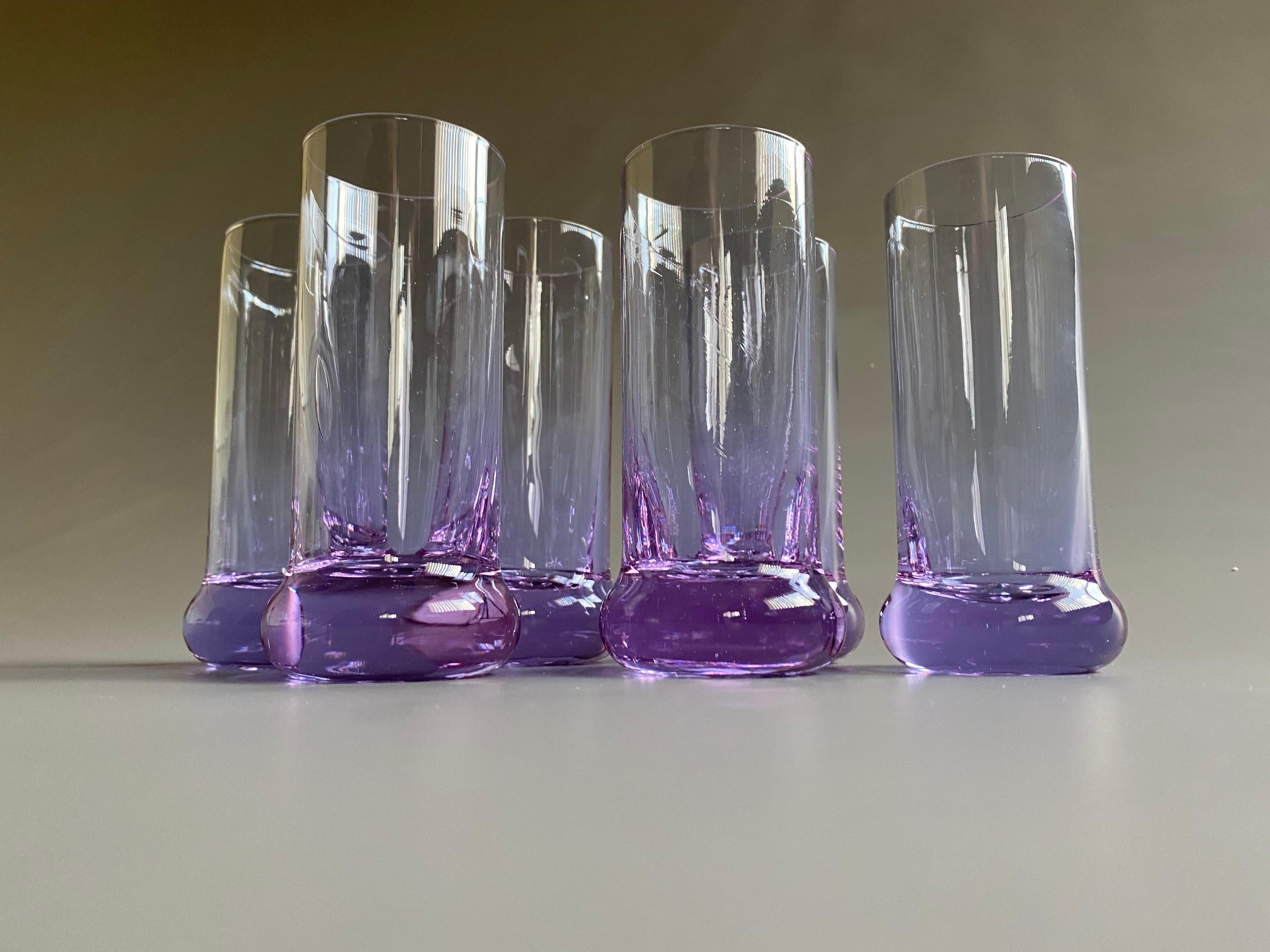 Stylish and elegant set of 6 hand blown long drink glasses from the 1970's. Produced by Arnolfo di Cambio in Italy. Depending on the light, the glasses are either purple or light blue as can be seen in the images. The set is without any damage.
The