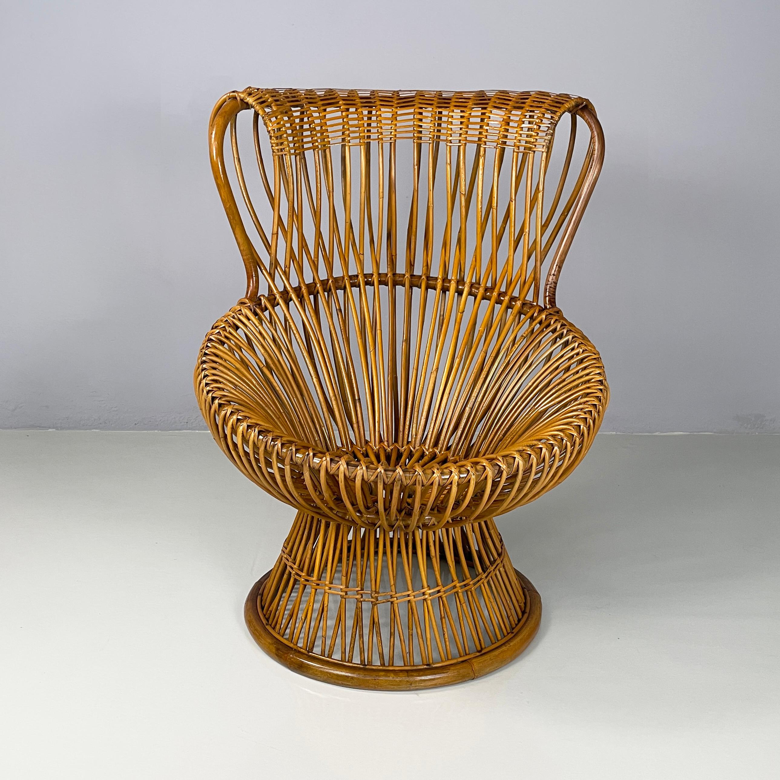 Italian mid-century modern Rattan armchair Margherita by Franco Albini for Bonacina, 1950s
iconic armchair mod. Margherita entirely in rush and wicker. The backrest follows the rounded seat. The base, also round, narrows under the seat and widens