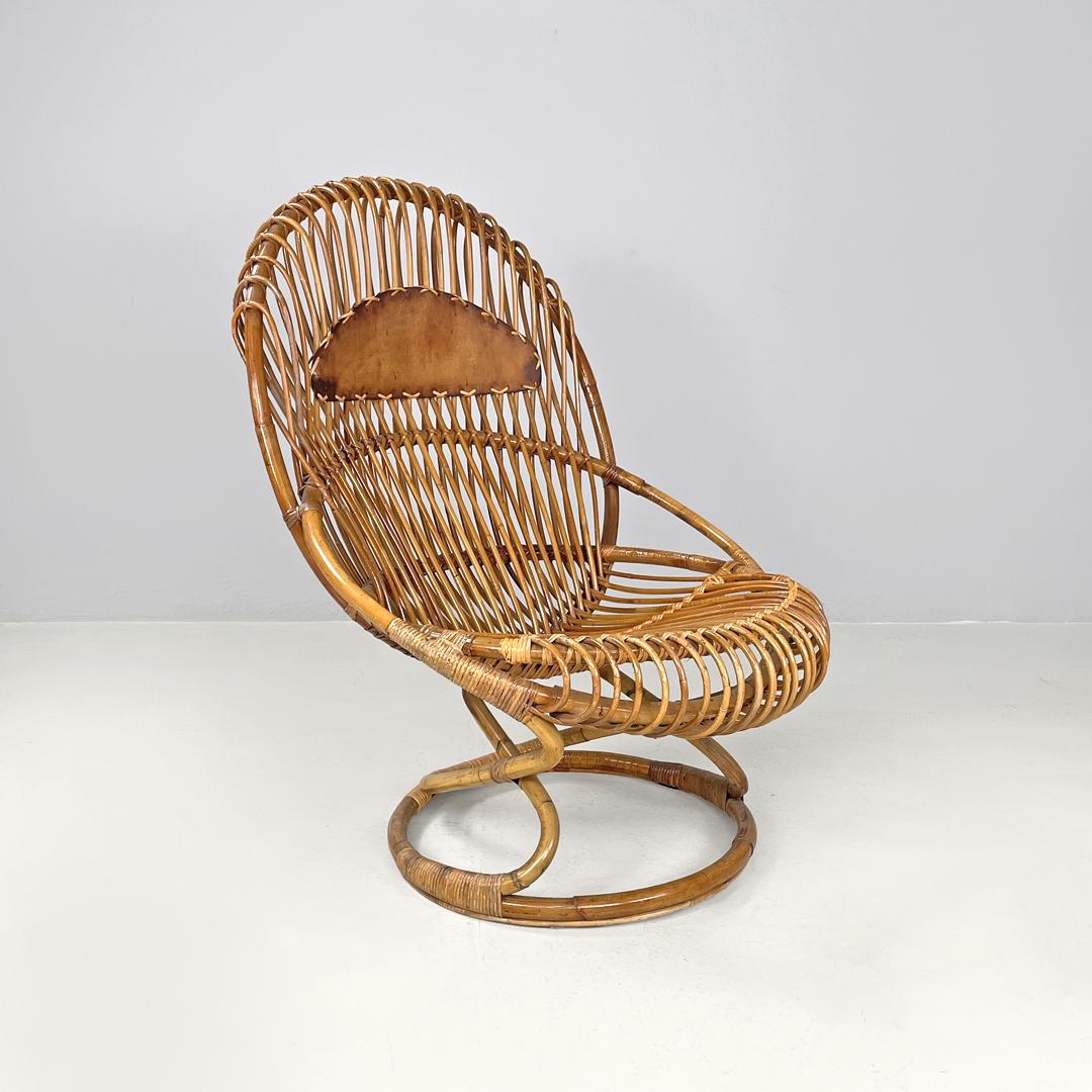 Italian mid-century modern rattan armchair Tre Cerchi Tito Agnoli Bonacina 1960s
Armchair mod. Tre Cerchi with round base in rattan. The structure is based on three circles that cross, intertwining, to form the seat, the backrest and the base. In