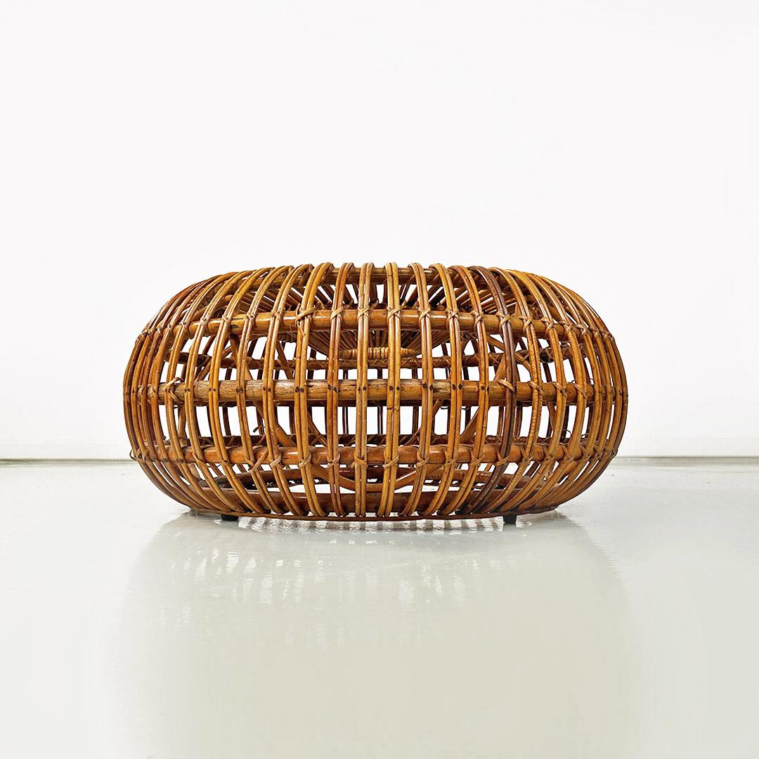 Italian mid century modern rattan footrest or pouf by Ico Parisi for Bonacina, 1960s
Rattan footrest or pouf with structure entirely in round rattan, with central hole, composed of many parallel concentric strips and weaves placed at the