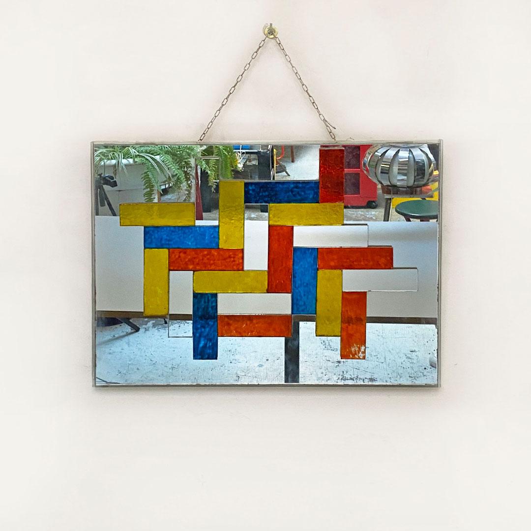 Italian Mid-Century Modern rectangular multicolored mirror, 1970s
Rectangular mirror with multicolored decorative motif and frame entirely in mirrored glass, with chipping in the lower left corner.
About 1970s
Good conditions.
Measurements in cm