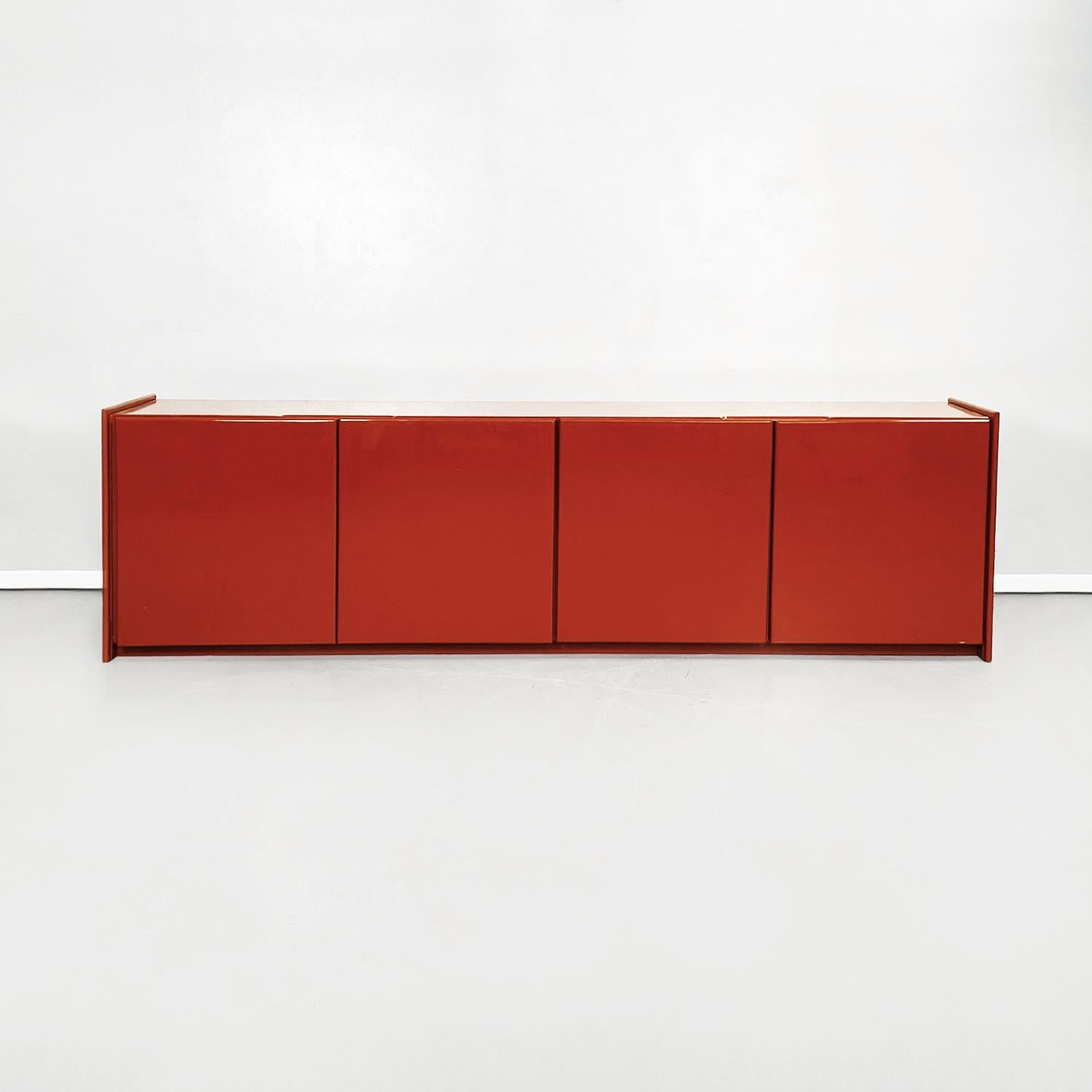Italian Mid-Century Modern rectangular red lacquered solid wood sideboard, 1980s
Rectangular red lacquered solid wood sideboard with rounded corners. The sideboard has 4 doors with hinged opening and inside each there is a wooden