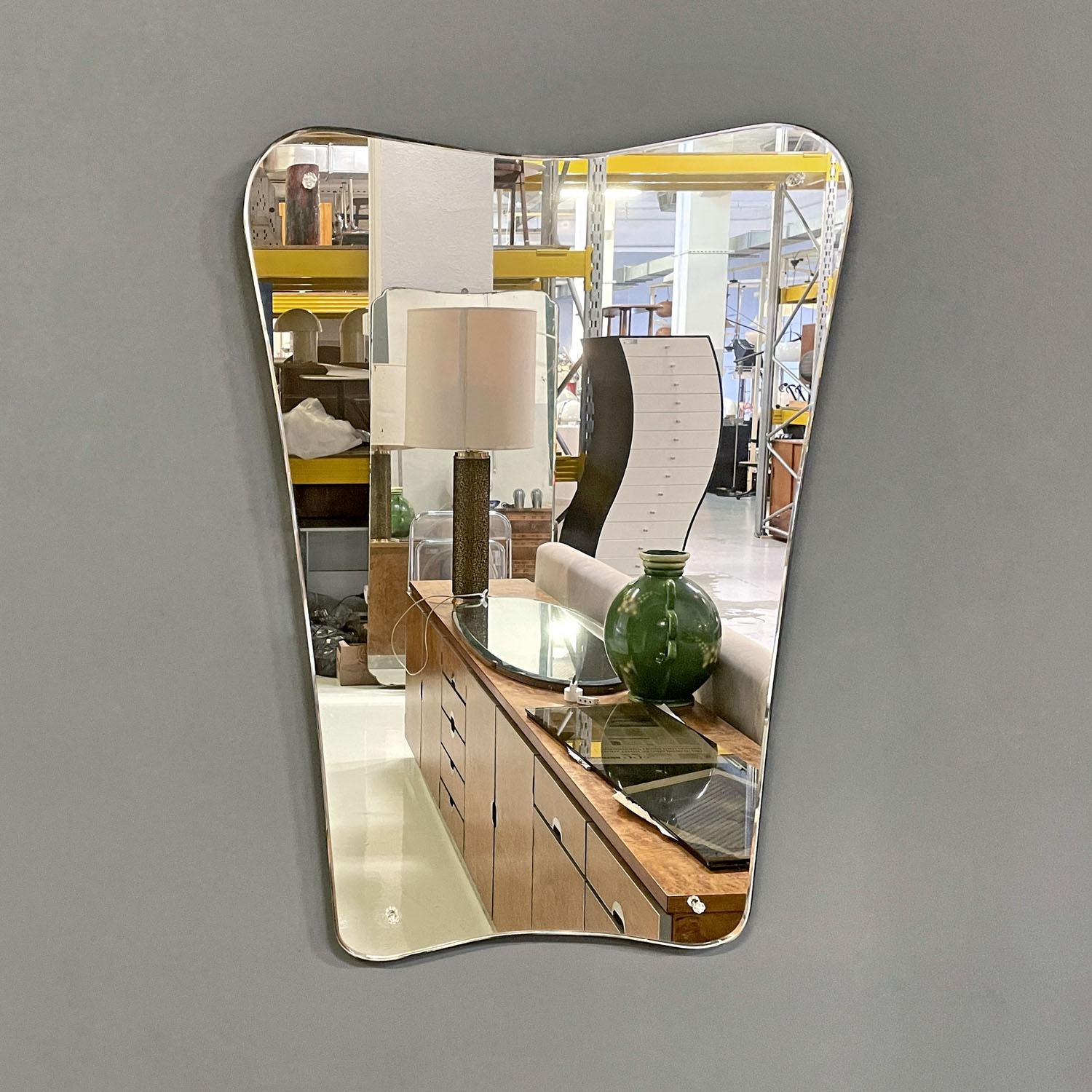 Italian mid-century modern rectangular wall mirror with glass knobs, 1950s
Wall mirror with a rectangular shape. The corners are rounded, the entire perimeter has curved and rounded lines. On the mirror at the corners there are four small