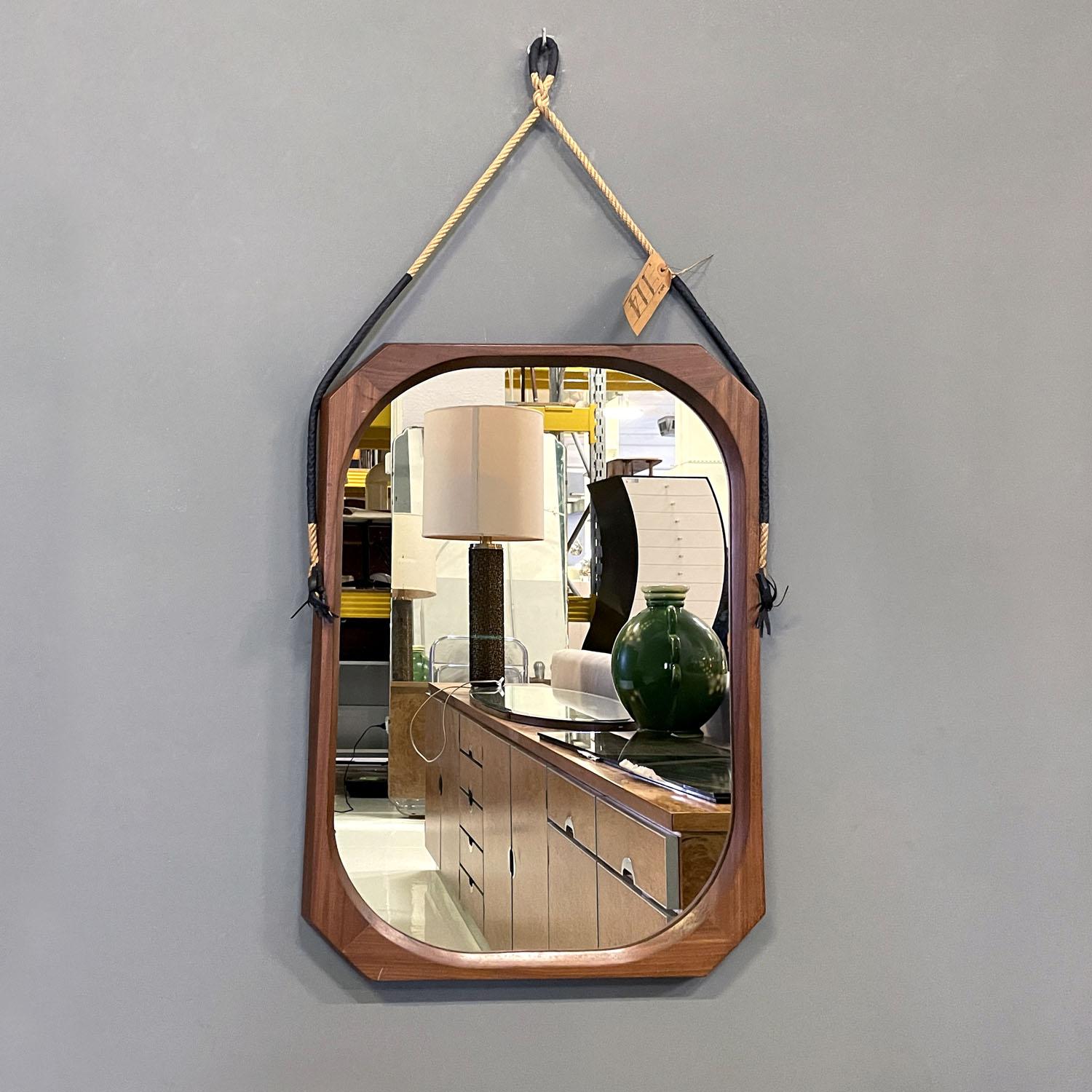 Italian mid-century modern rectangular wooden wall mirror with rope, 1960s
Rectangular wooden wall mirror. The frame has the corners cut externally and internally it is shaped to create a rounded shape. The frame is thick and the mirror part remains