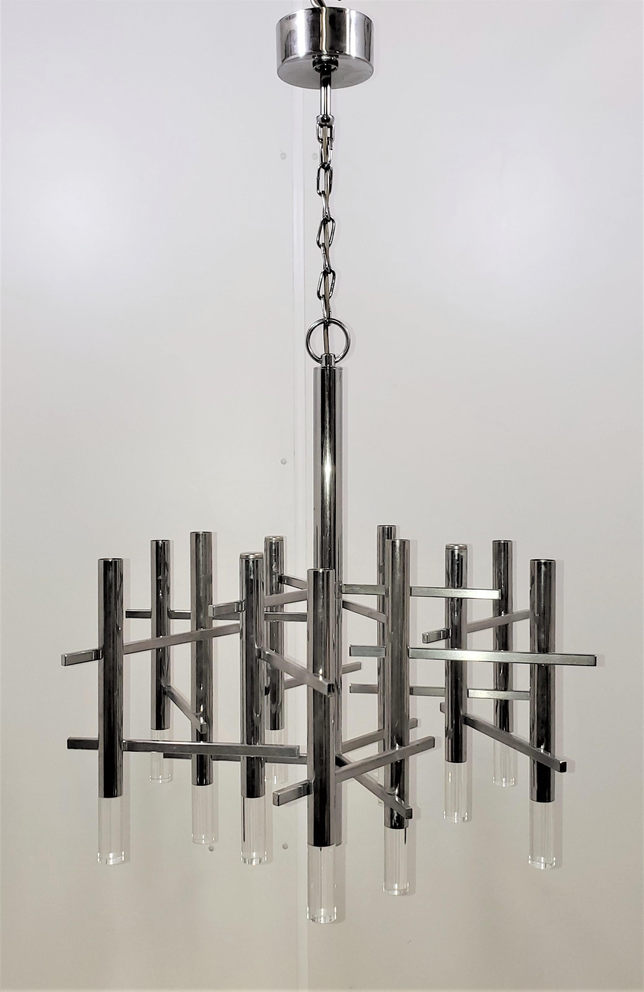 A dynamic and kinetic Mid-Century Modernist/ Space Age chandelier in chrome and lucite by Gaetano Sciolari.
The total height can be shortened to ~31