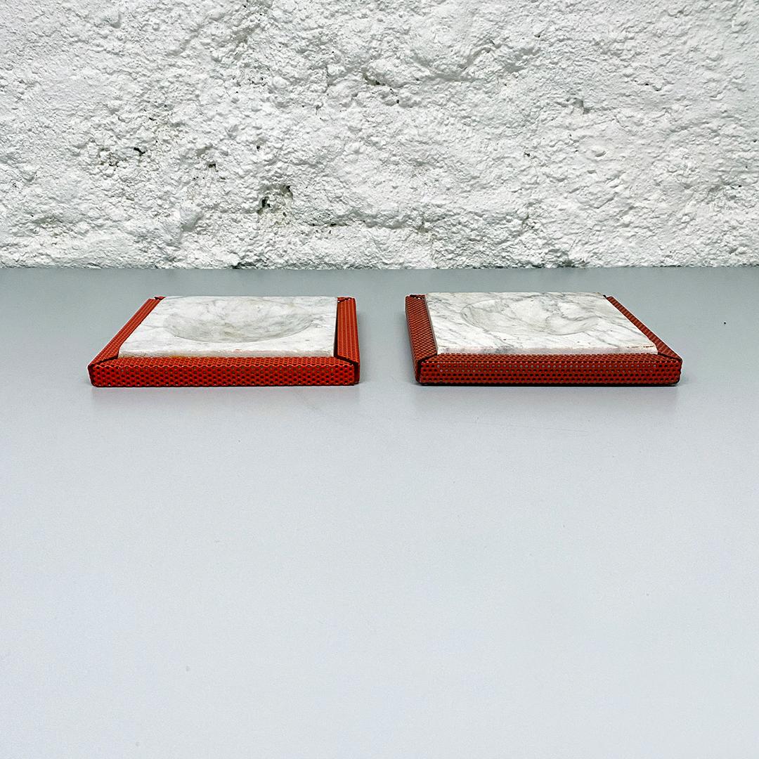 Italian Mid-Century Modern red marble and micro-perforated metal ashtrays, 1980s
Red marble and metal ashtrays with micro-perforated metal structure.
The two ashtrays have two different shades of red.

Good condition, in some places the metal is