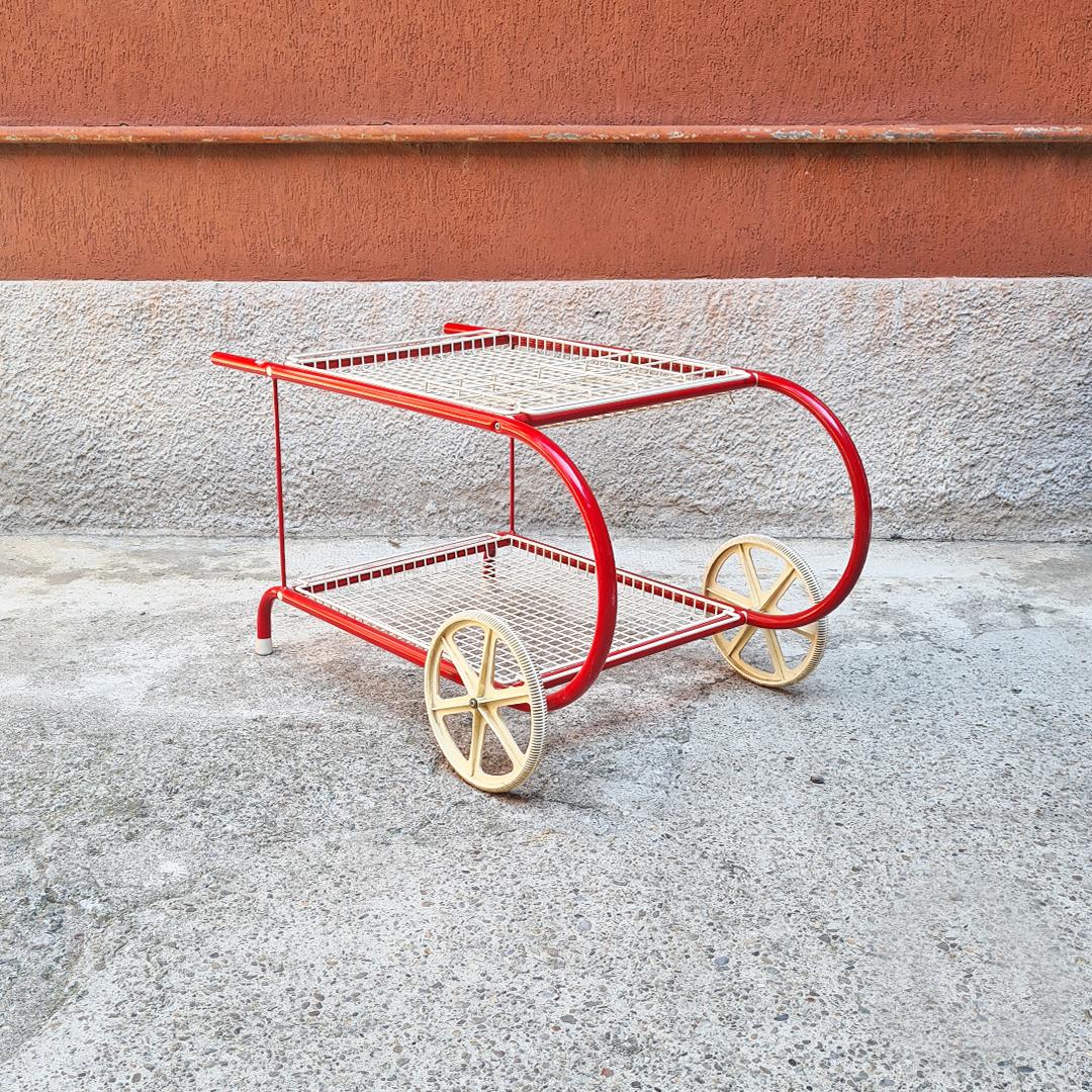Italian Mid-Century Modern red metal food cart by Emu, 1980s
Food cart with particular structure in red metal, grid shelves removable and  wheels and tips in white plastic. Made in Italy by Emu.

Good conditions

Measures: 107 x 62 x 56 H.
  