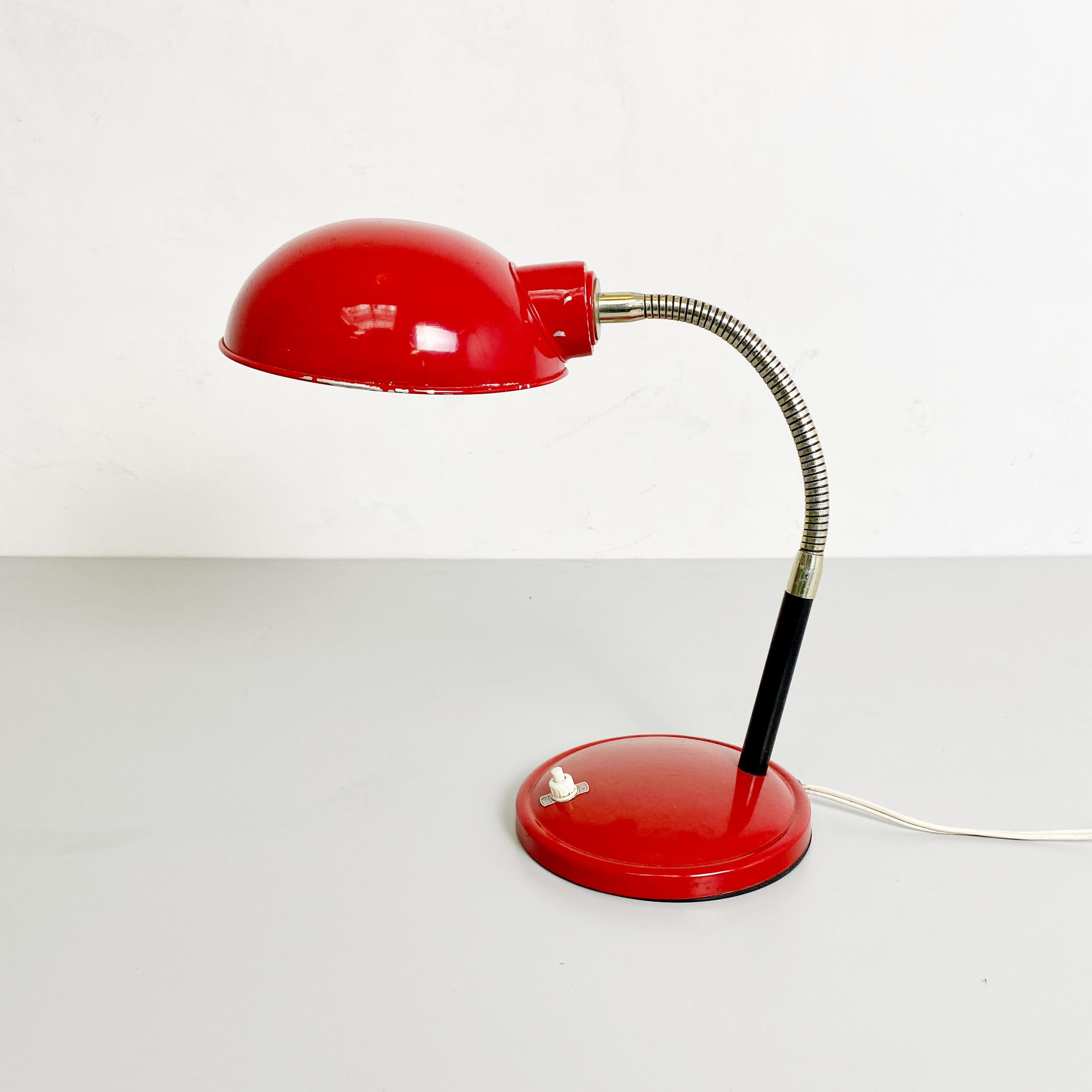 Very particular and very RED Italian Mid-Century Modern with red base and red lamshade and chromed tube flexible that reflex the red!
Probably its a 1960s Period for sure its Italian!

The lamp is all in metal, and have an heavy base, and an