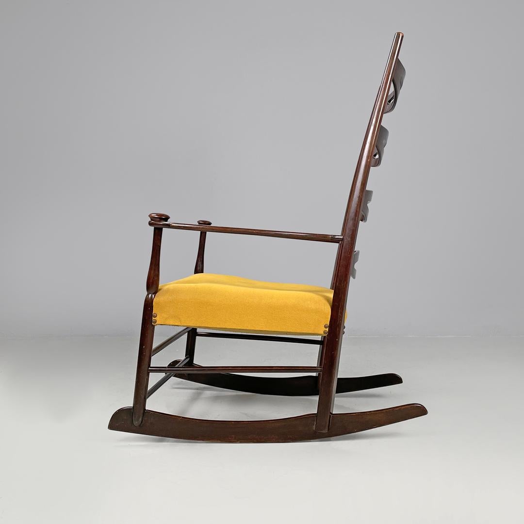 Italian mid-century modern rocking chair in wood and mustard yellow fabric 1960s In Fair Condition In MIlano, IT