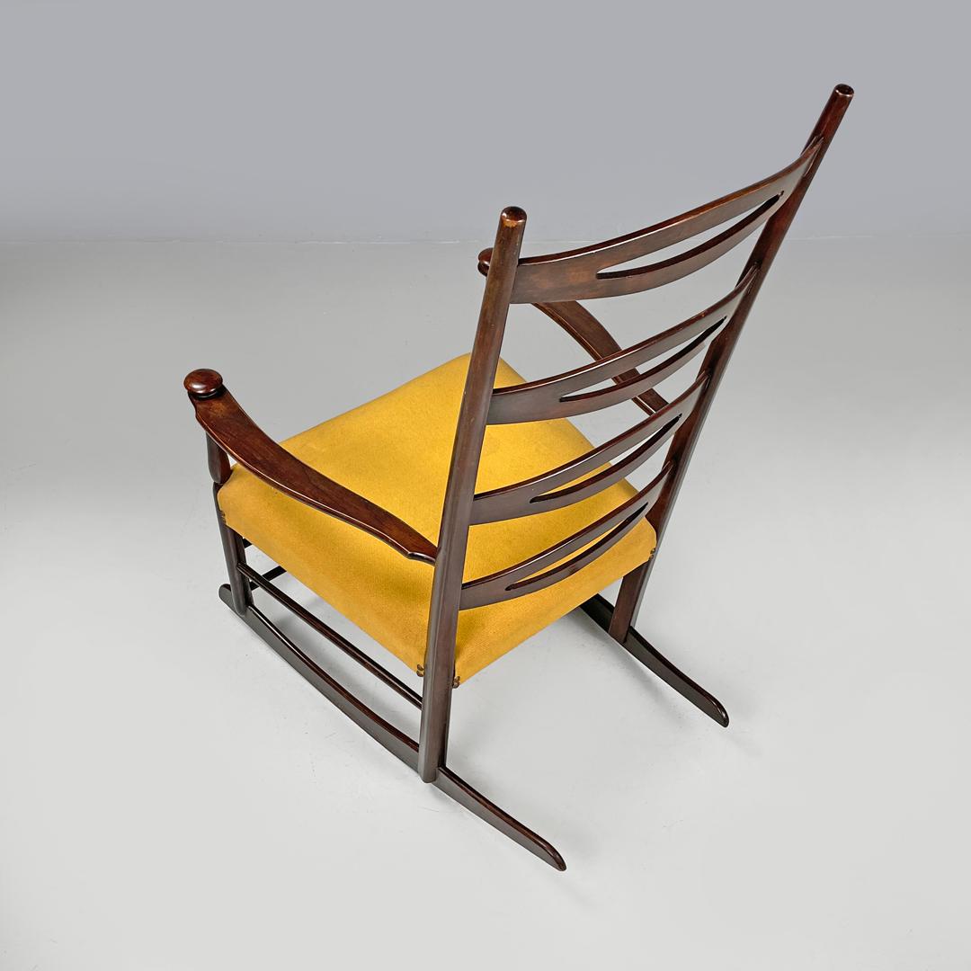 Mid-20th Century Italian mid-century modern rocking chair in wood and mustard yellow fabric 1960s