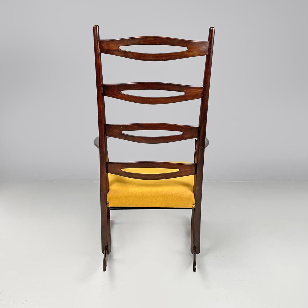 Brass Italian mid-century modern rocking chair in wood and mustard yellow fabric 1960s