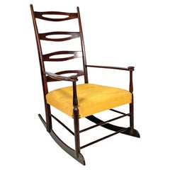 Italian mid-century modern rocking chair in wood and mustard yellow fabric 1960s