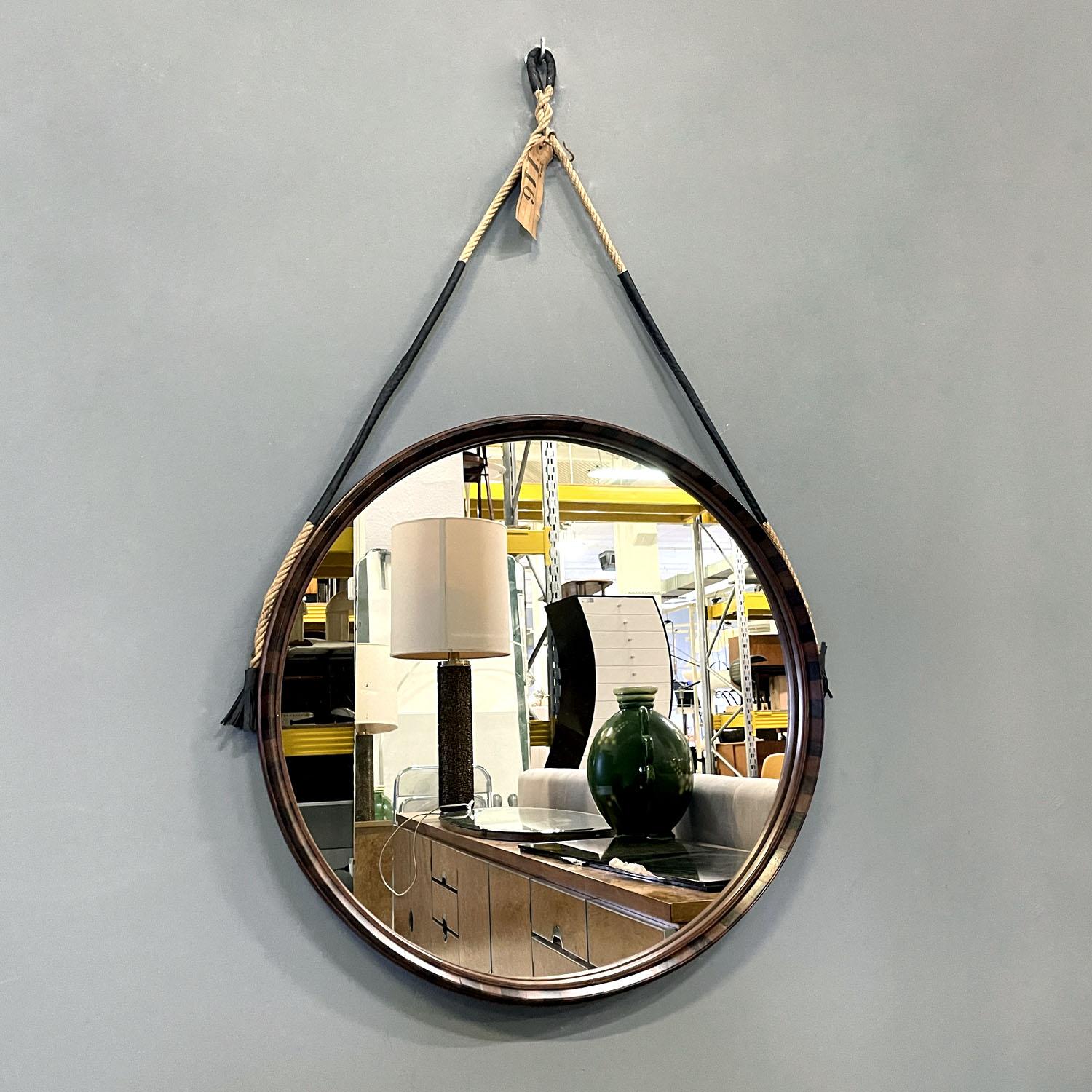 Italian mid-century modern rounded two toned wood wall mirror with rope, 1960s
Round wooden wall mirror. The frame is made up of alternating two woods of different colors to create a regular geometric decoration. The frame is thick and the mirror