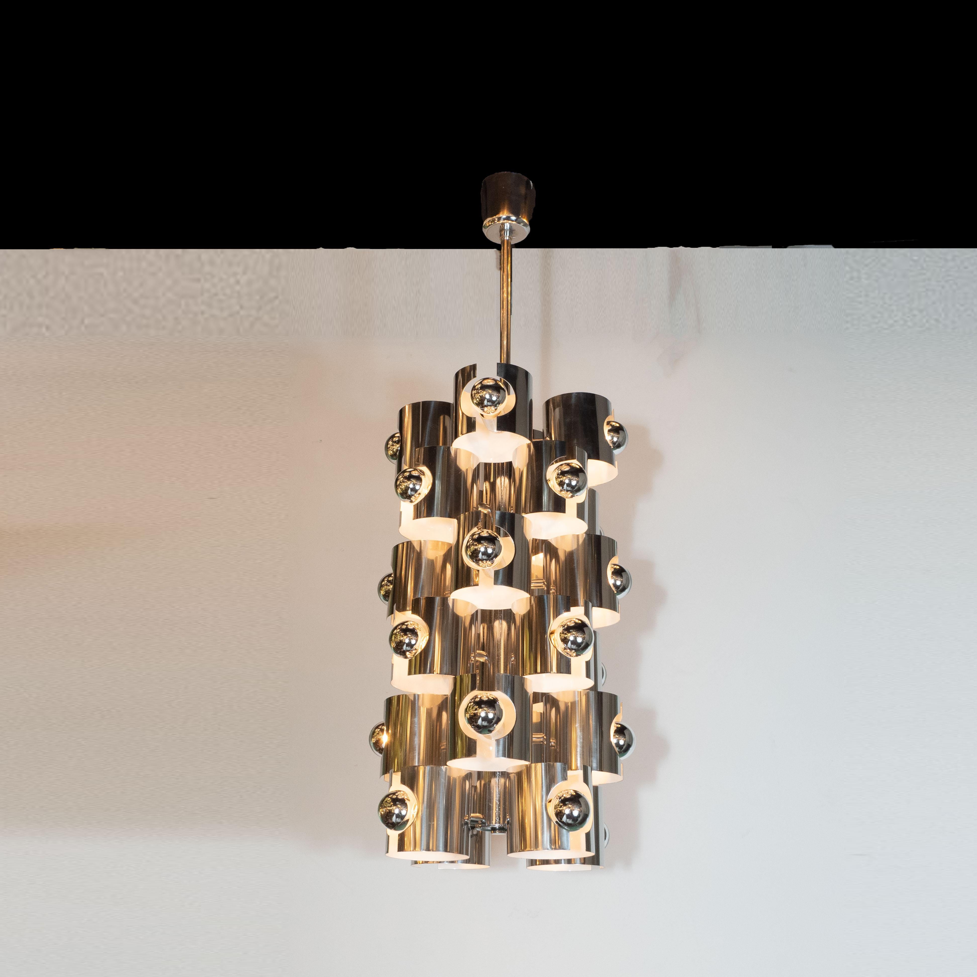 This sculptural and graphic Mid-Century Modern chandelier was realized by the esteemed lighting atelier, Gaetano Sciolari, in Italy circa 1970. A rare and especially stunning example of his practice, this features six tiers extending from a central