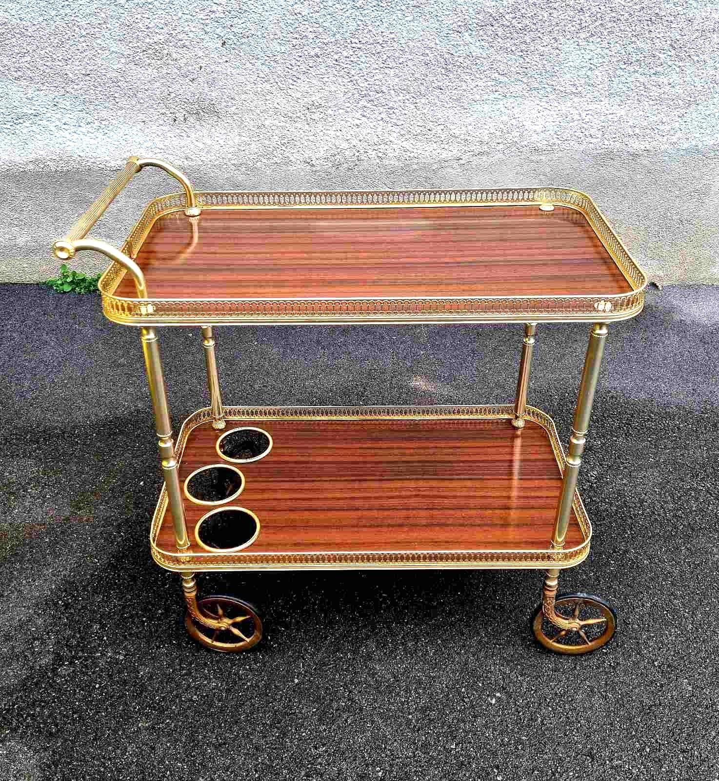 This gorgeous Mid Century Serving Trolley was made in Italy in '60s.
It is made of metal, formica and plastic.
This Trolley is in perfect vintage condition. Very stylish addition to your kitchen, dining room or living room; also as stand alone piece