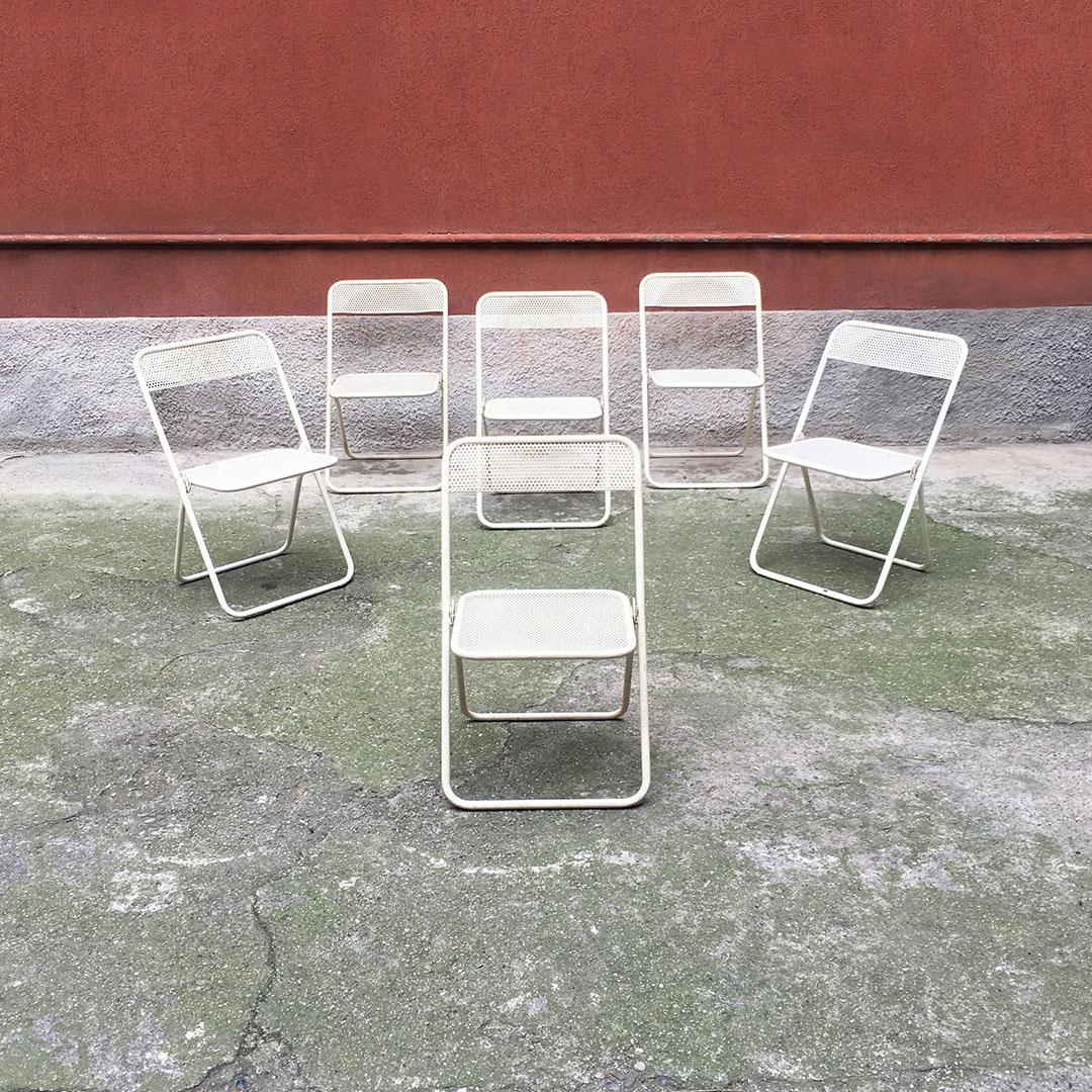 Italian Mid-Century Modern set of outdoor folding metal chairs, 1980s
Set of six outdoor folding chairs, with enameled iron structure and micro-perforated seat and back.

Good vintage condition.

51x55x77h cm.