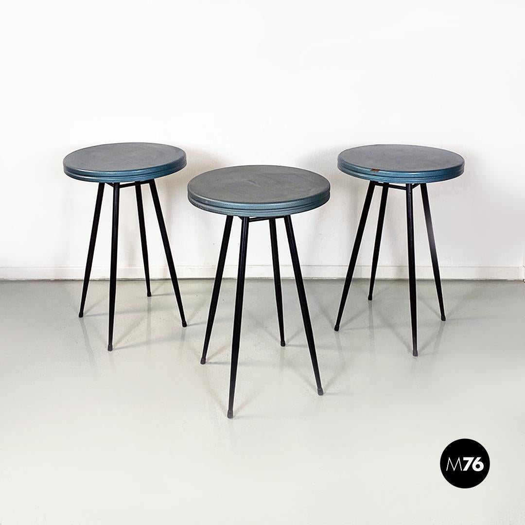 Italian Mid-Century Modern set of three black and grey-blue bar tables, 1950s
Set of three bar tables with round blue painted metal top and black metal legs.
Coming from a famous Turin nightclub from the 1950s.
Good condition, small signs of