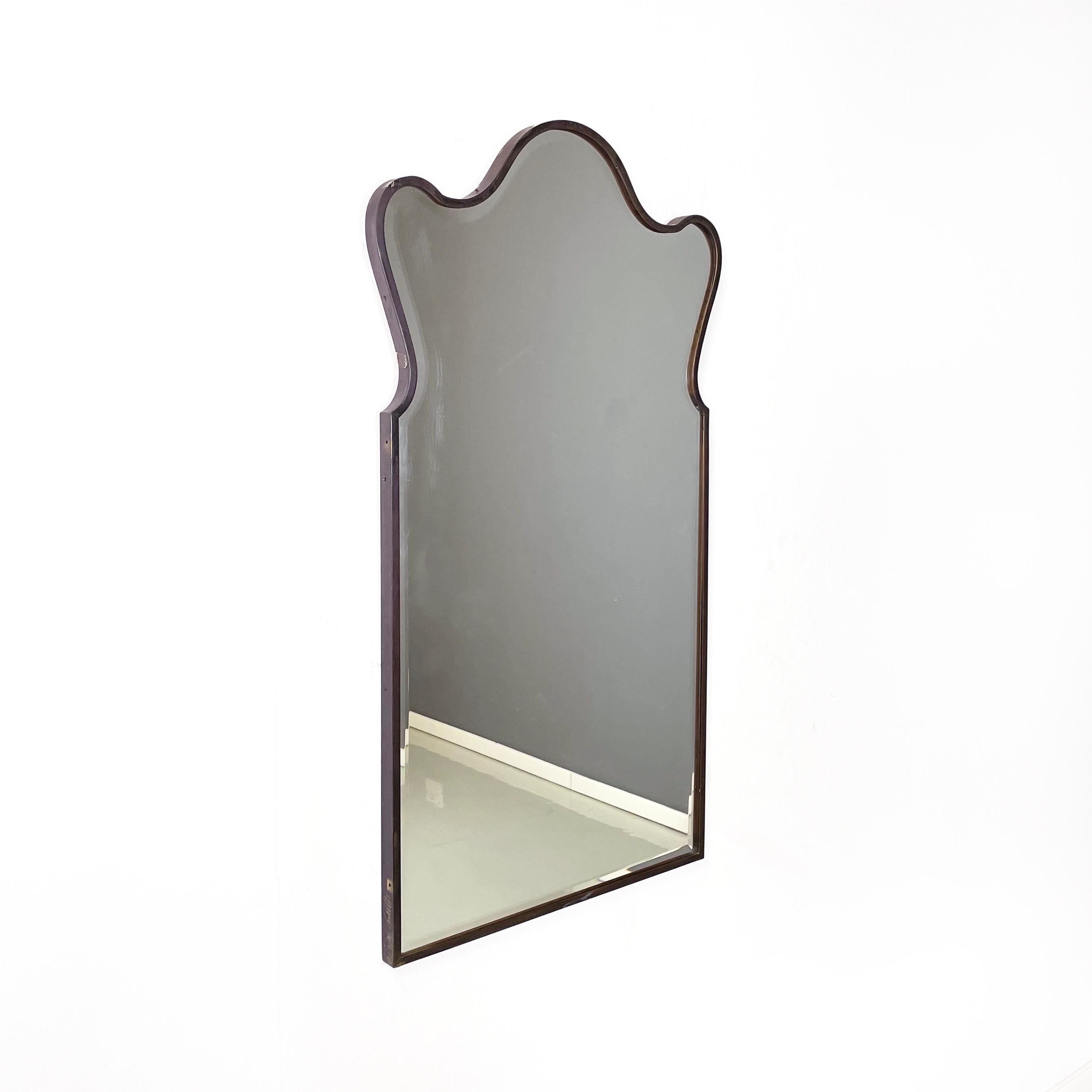 Italian mid century modern Shaped wall mirror in dark metal frame, 1960s
Wall mirror with shaped dark metal frame. The upper part of the mirror is rounded, while the lower part is squared. Internal wooden structure.
1960 approx.
Vintage condition,
